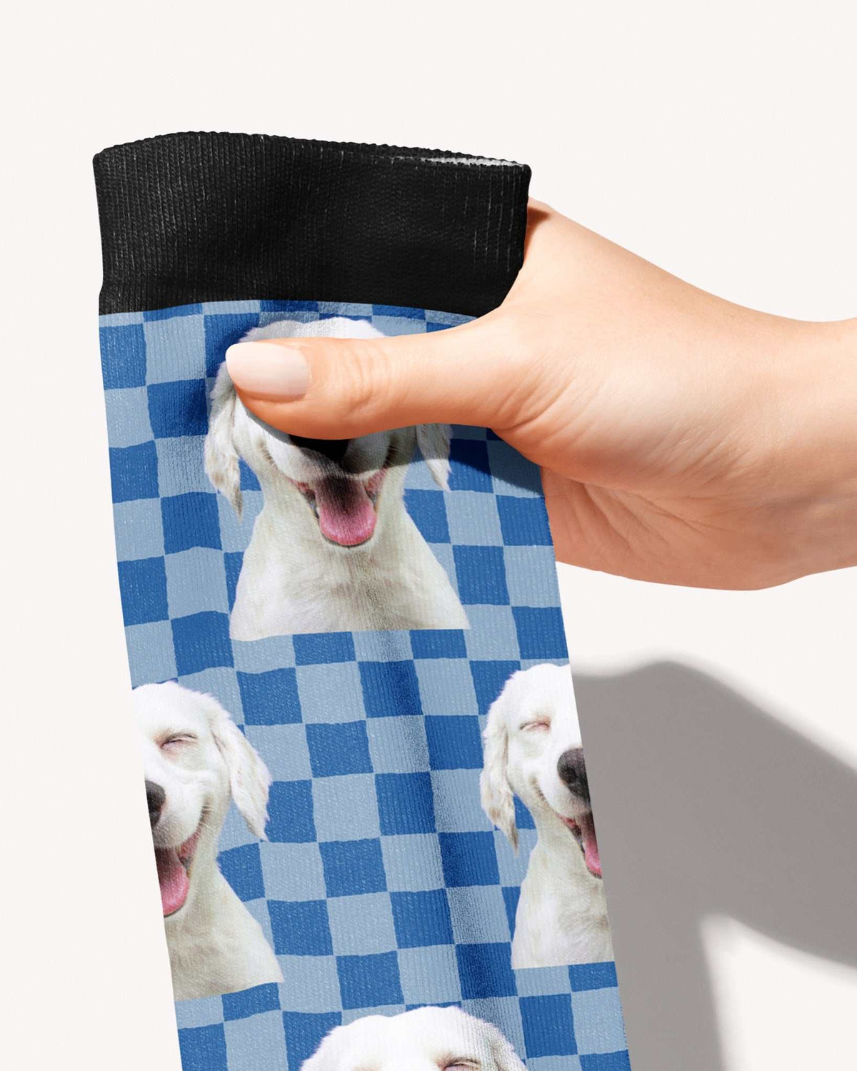 Checkered custom photo equestrian boot socks, held in hand, close-up of the blue checkerboard pattern, by Dreamers & Schemers