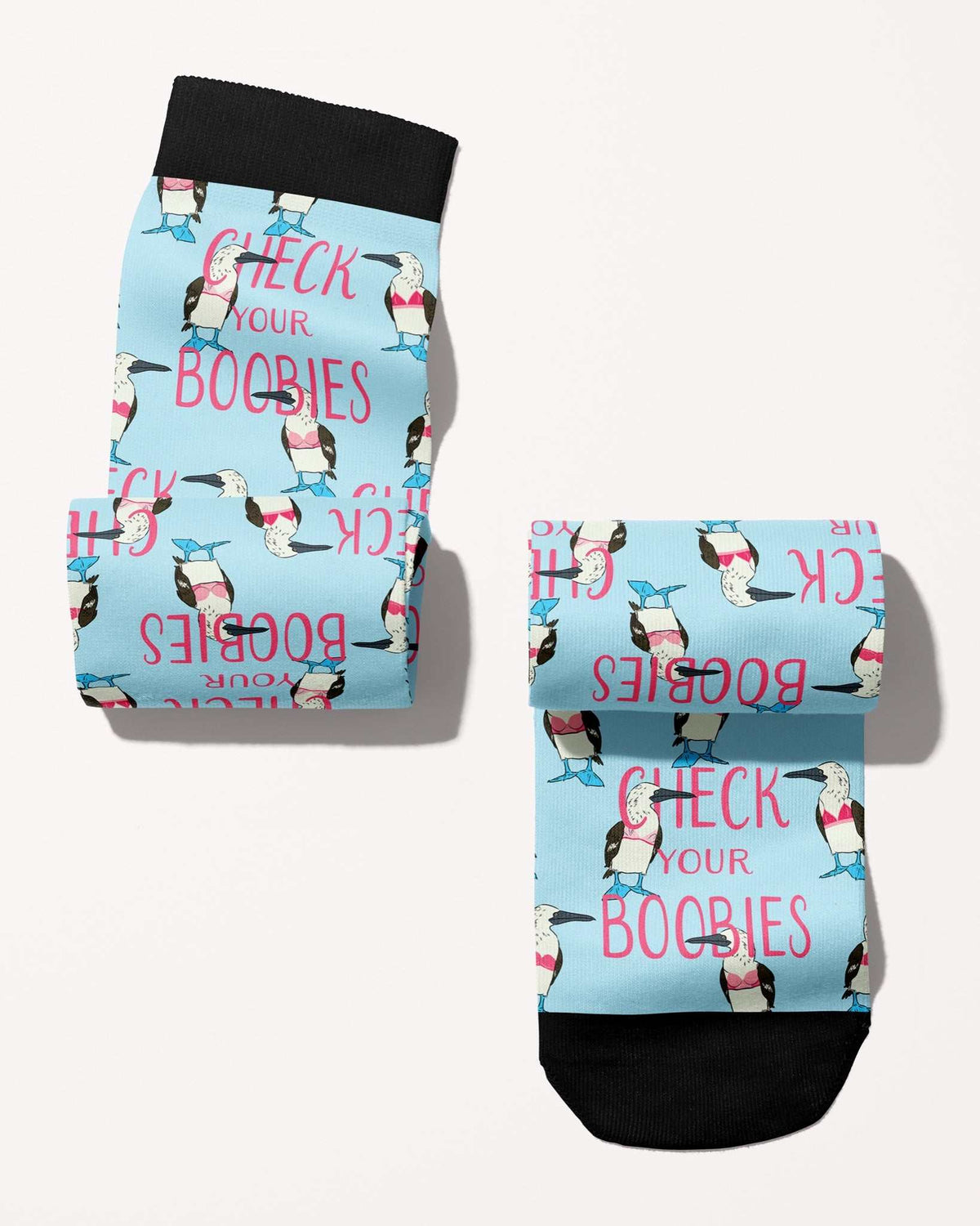Check Your Boobies Limited Edition boot socks, blue-footed boobies and pink lettering on sky blue, rolled, showing the pattern repeat, by Dreamers & Schemers