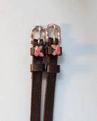 Crabbin' ManeJane spur straps with the signature Crabbin' charm, shown on an off-white background