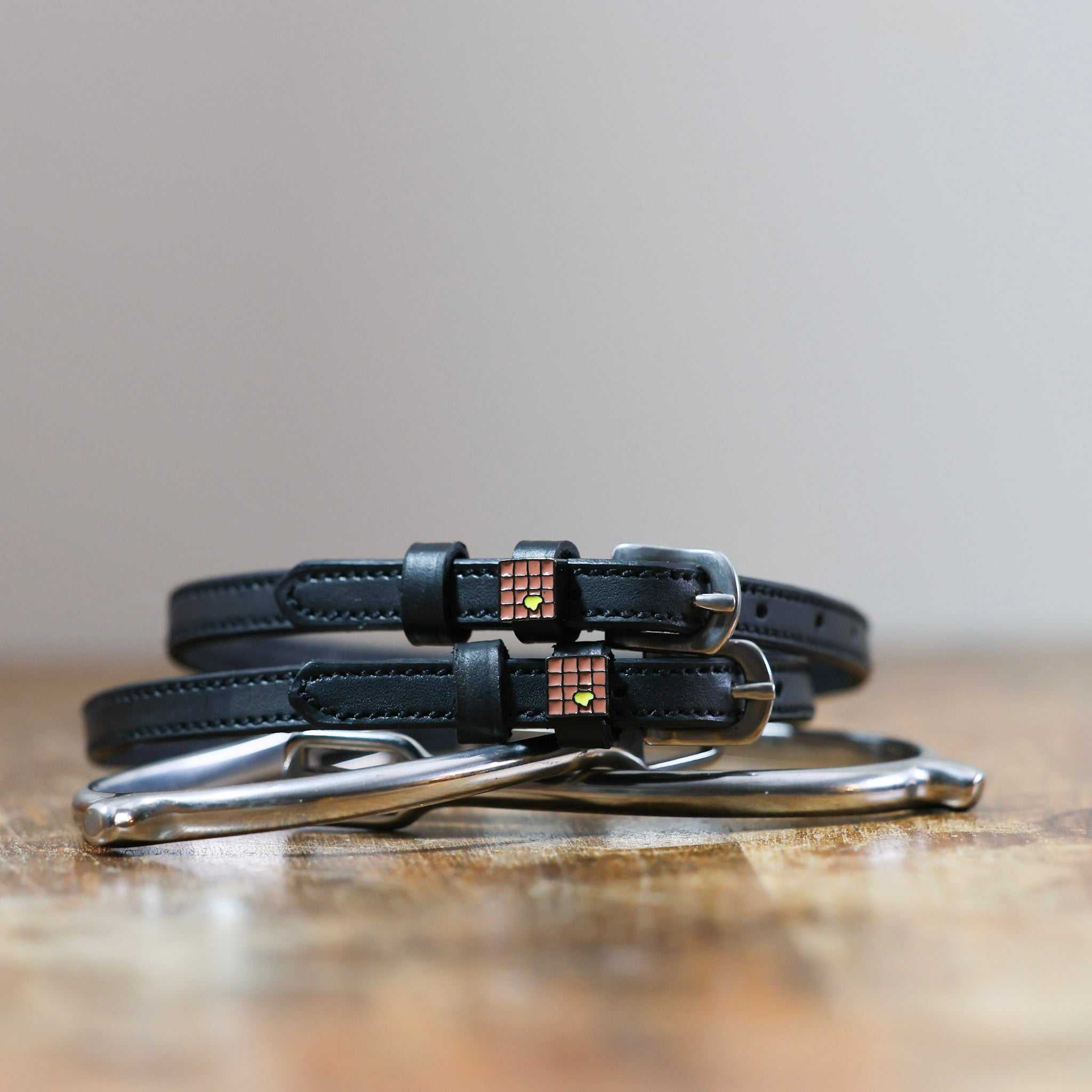 ManeJane Waffle Spur Straps Spur Straps — black leather, non-stretch, hero image for English riders.