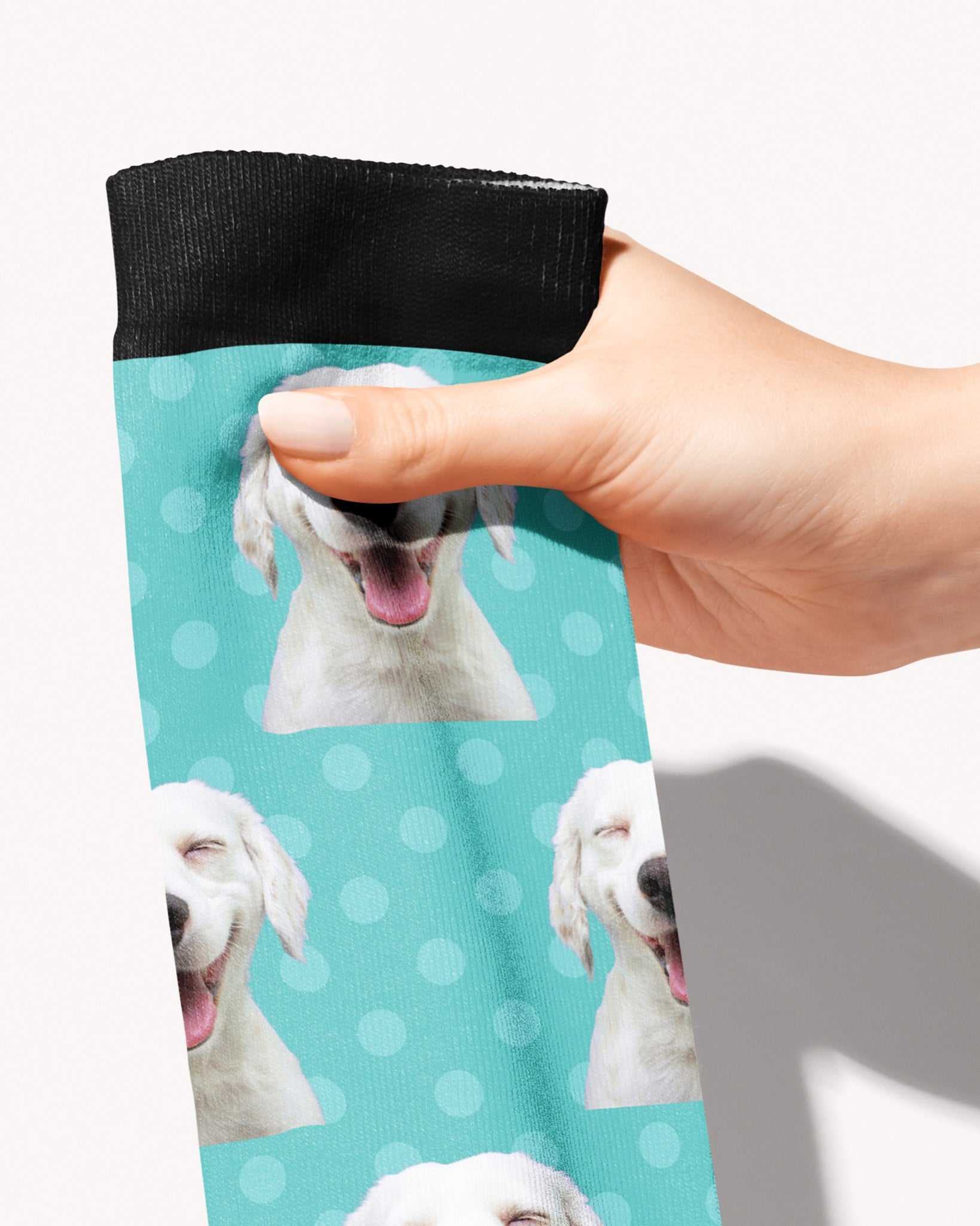 Dots custom photo equestrian boot socks, held in hand, close-up of the polka dot pattern, by Dreamers & Schemers
