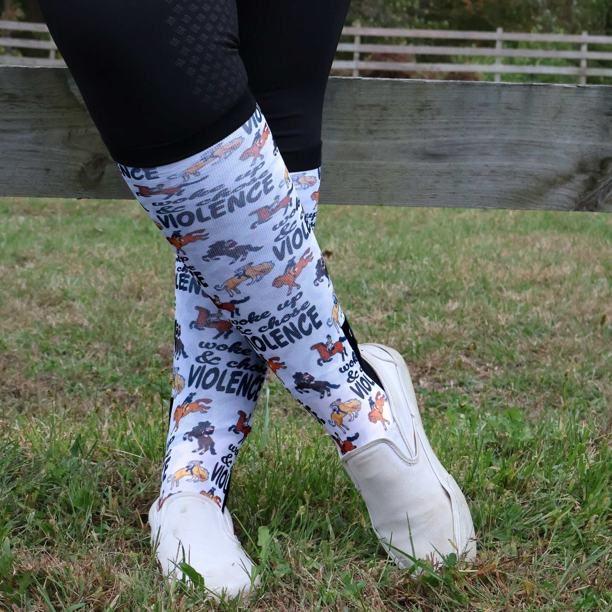 Limited edition Woke Up Chose Violence boot socks with bold text and colorful dog illustrations, made in the USA