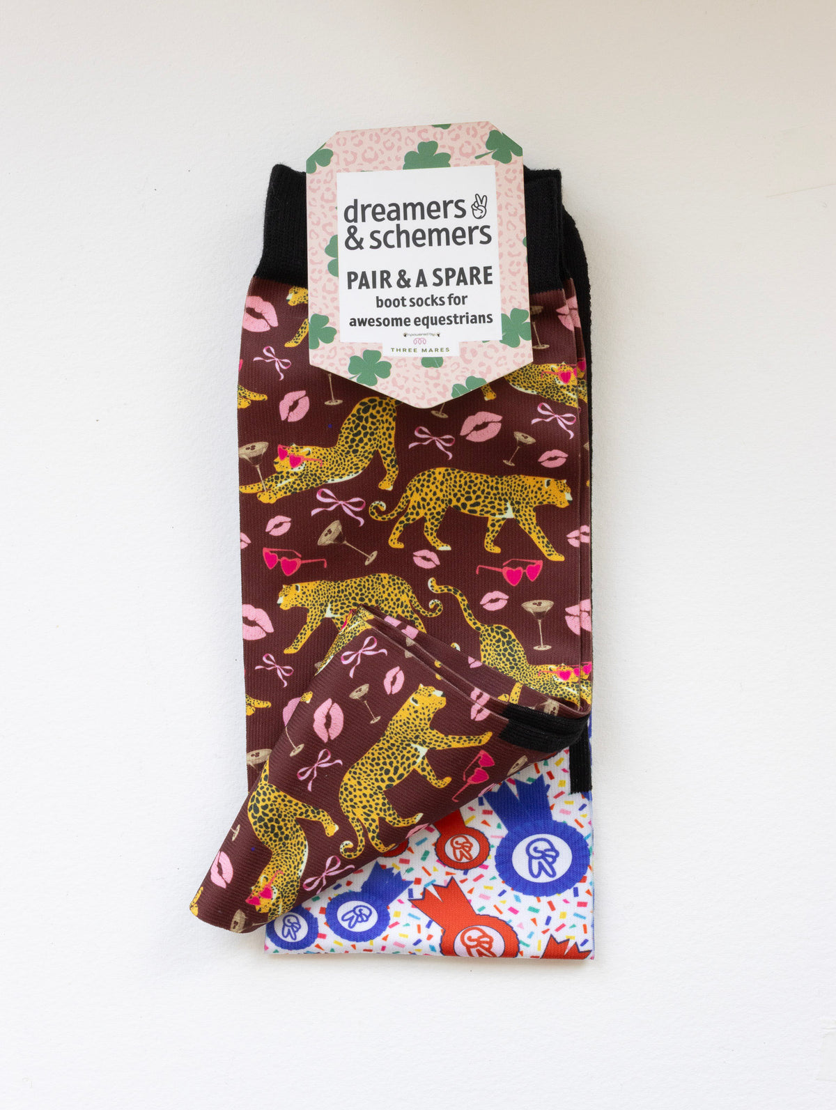 Ready to Play boot socks shown folded with the included spare sock and printed cuff detail