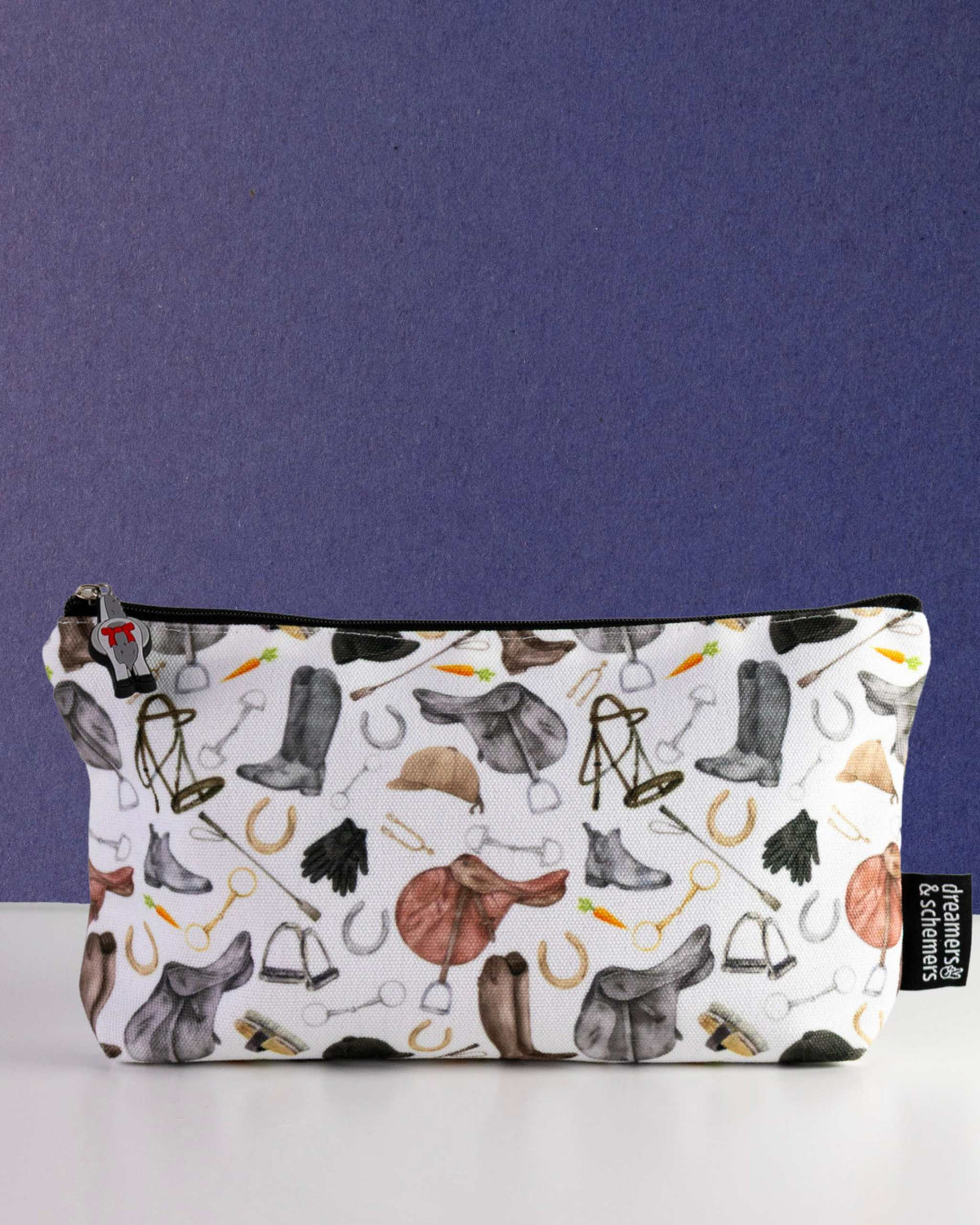 The Hunt zip pouch in white canvas, printed with watercolour saddles, tall boots and bits, by Dreamers & Schemers