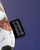 Woven dreamers & schemers label stitched into the seam of The Hunt pouch, saddle print behind