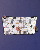 The Hunt zip pouch photographed flat, showing the full spread of hunt-field tack across the canvas