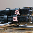 Black leather Piggy Spur Straps with stainless steel buckles and pig charm accents