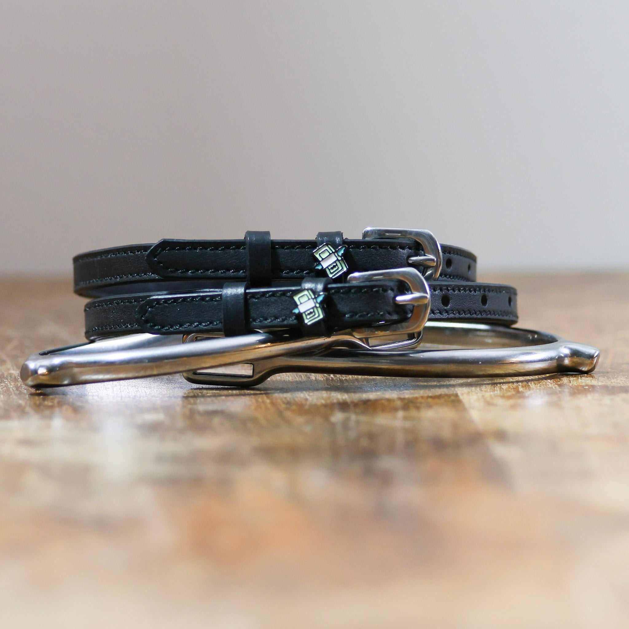 Non-stretch black spur straps with stainless steel buckles from the Cash Money Bundle equestrian set