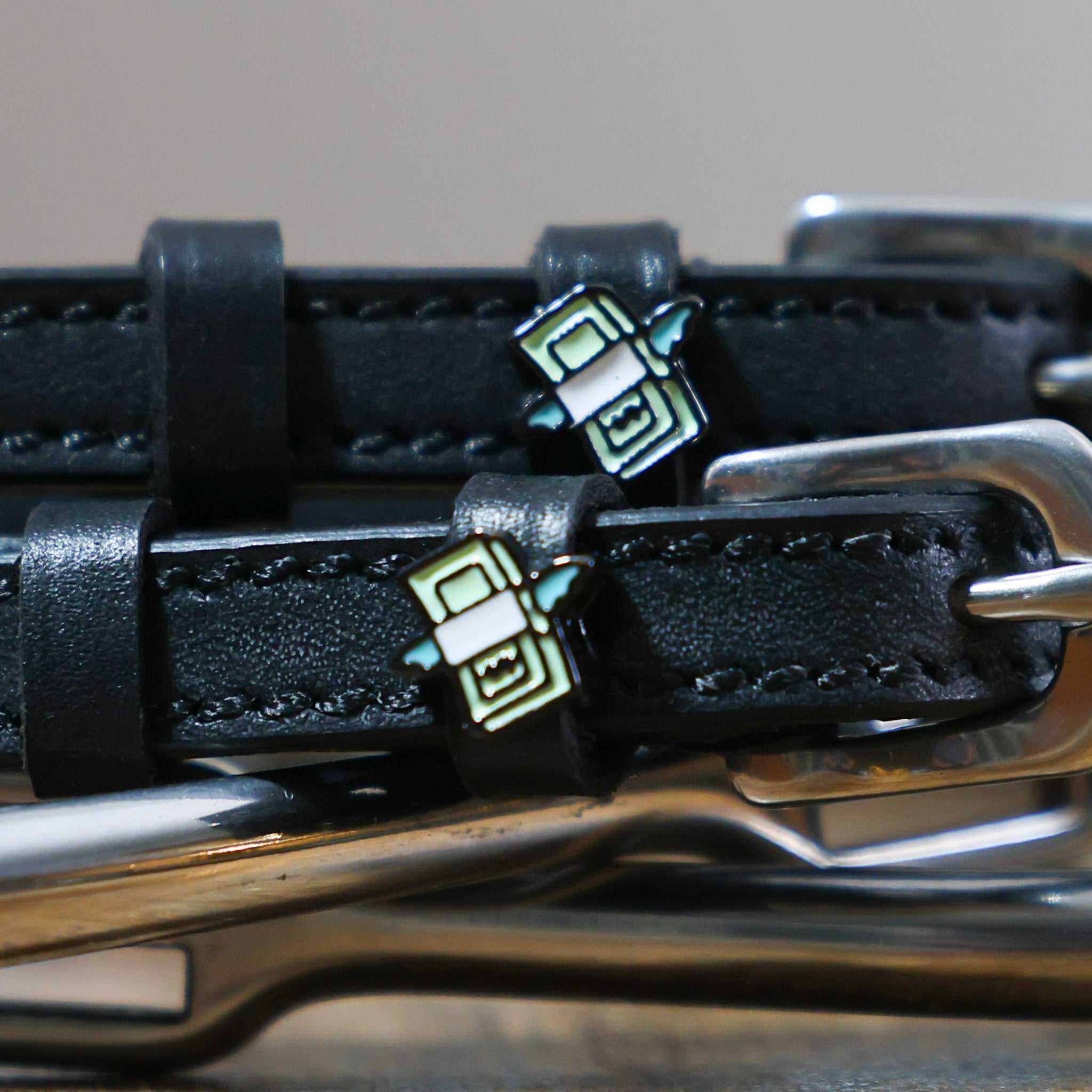Black leather Cash Money Spur Straps with stainless steel buckles and custom charm
