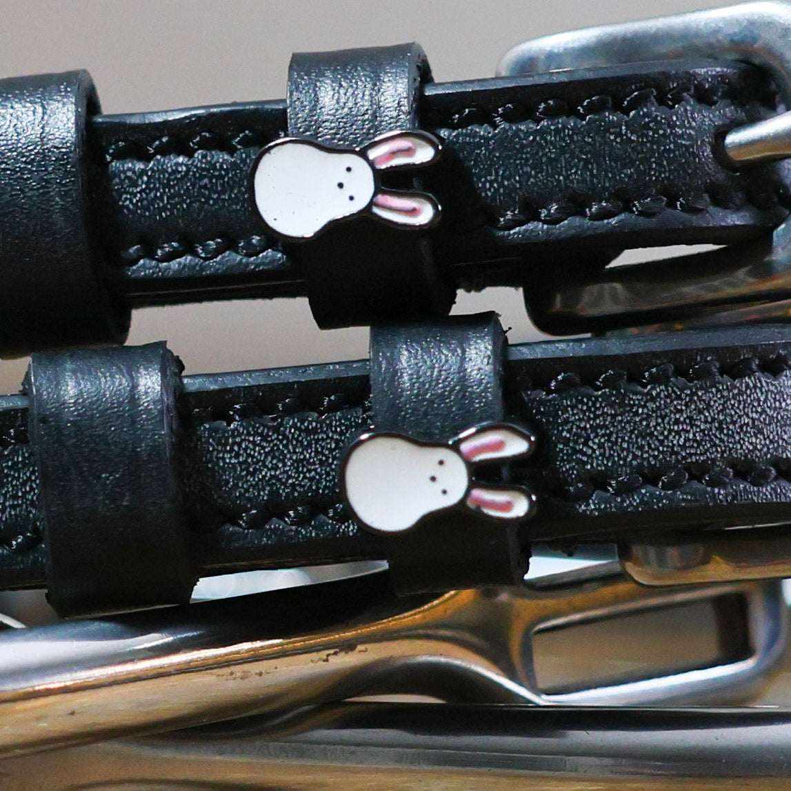 Bunny Hop Spur Straps black leather with stainless steel buckle and bunny charm