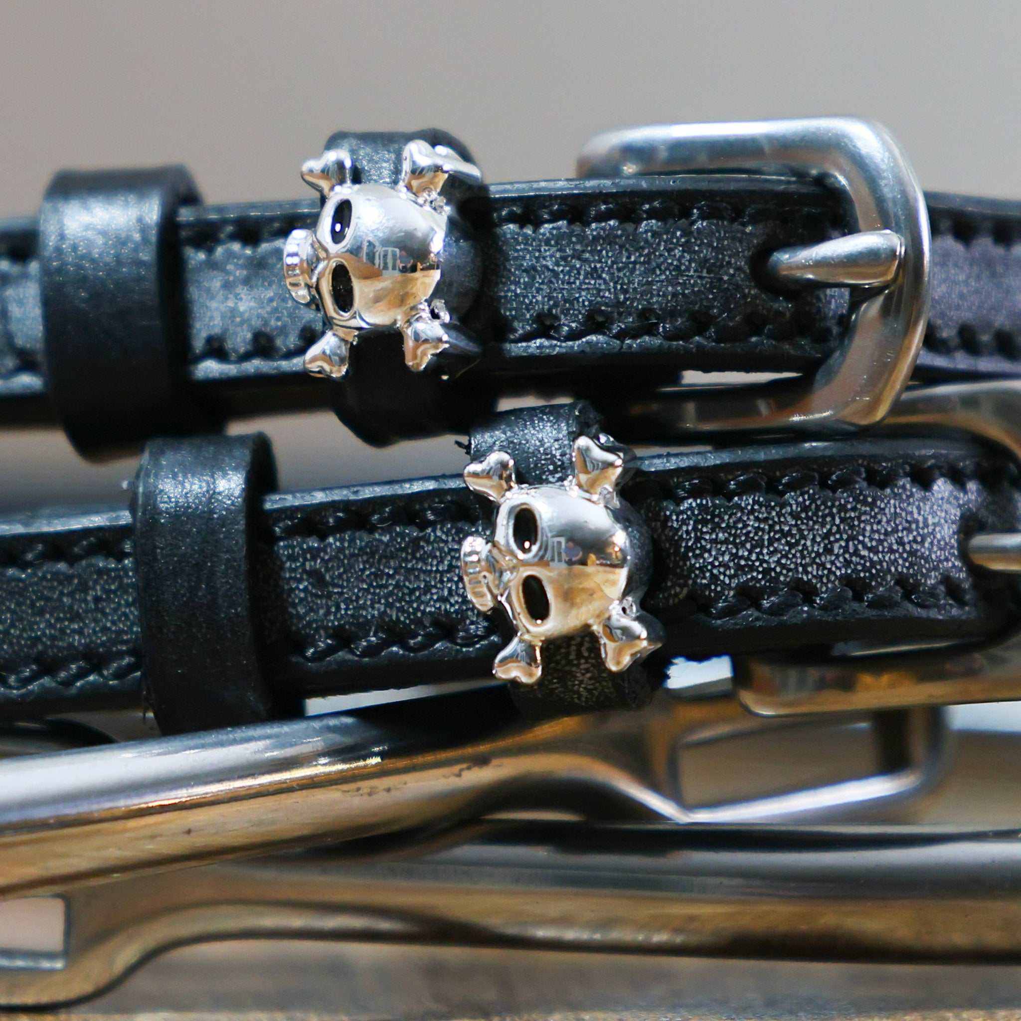 Black leather Skull & Crossbones Spur Straps with stainless steel buckles and custom skull charms