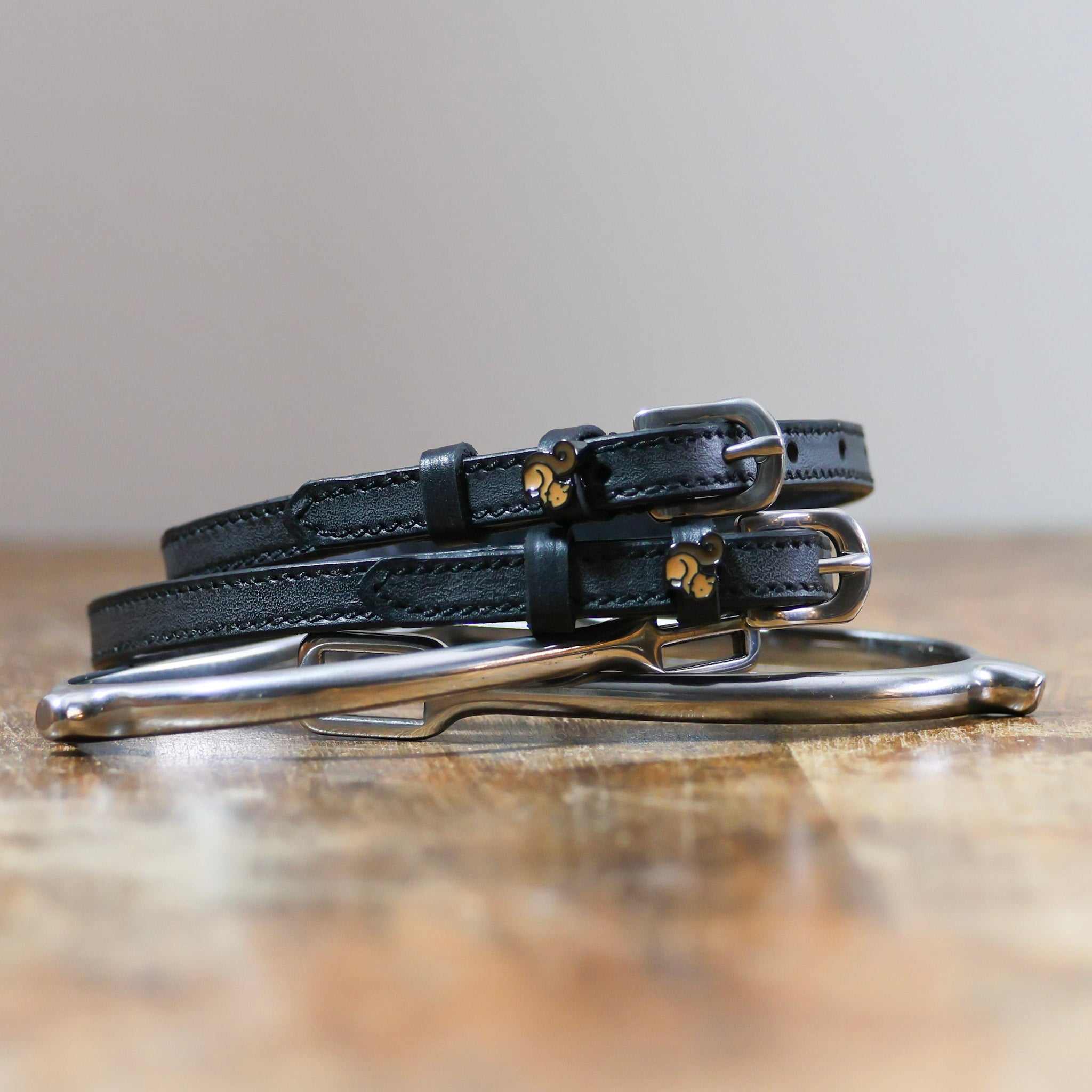 ManeJane Squirrel Spur Straps Spur Straps — black leather, non-stretch, hero image for English riders.