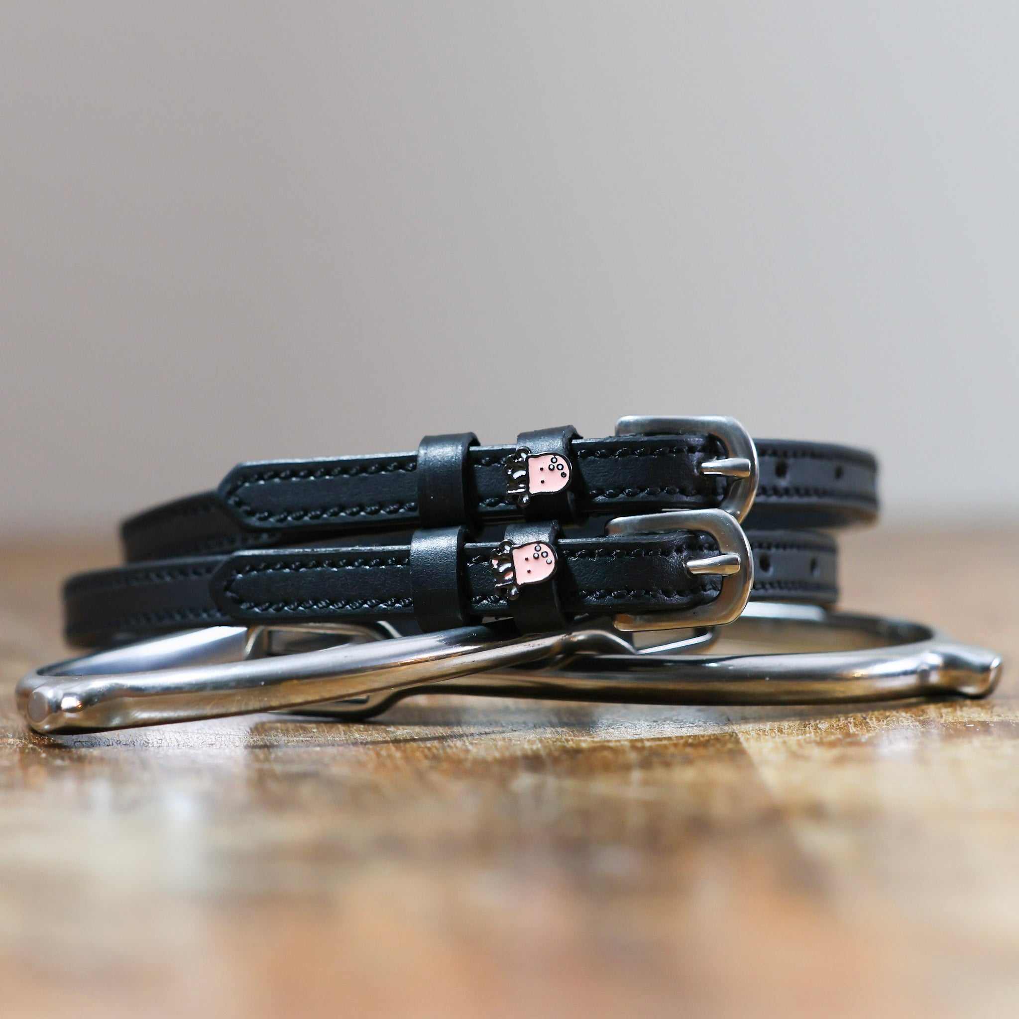 ManeJane Octopus Spur Straps Spur Straps — black leather, non-stretch, hero image for English riders.