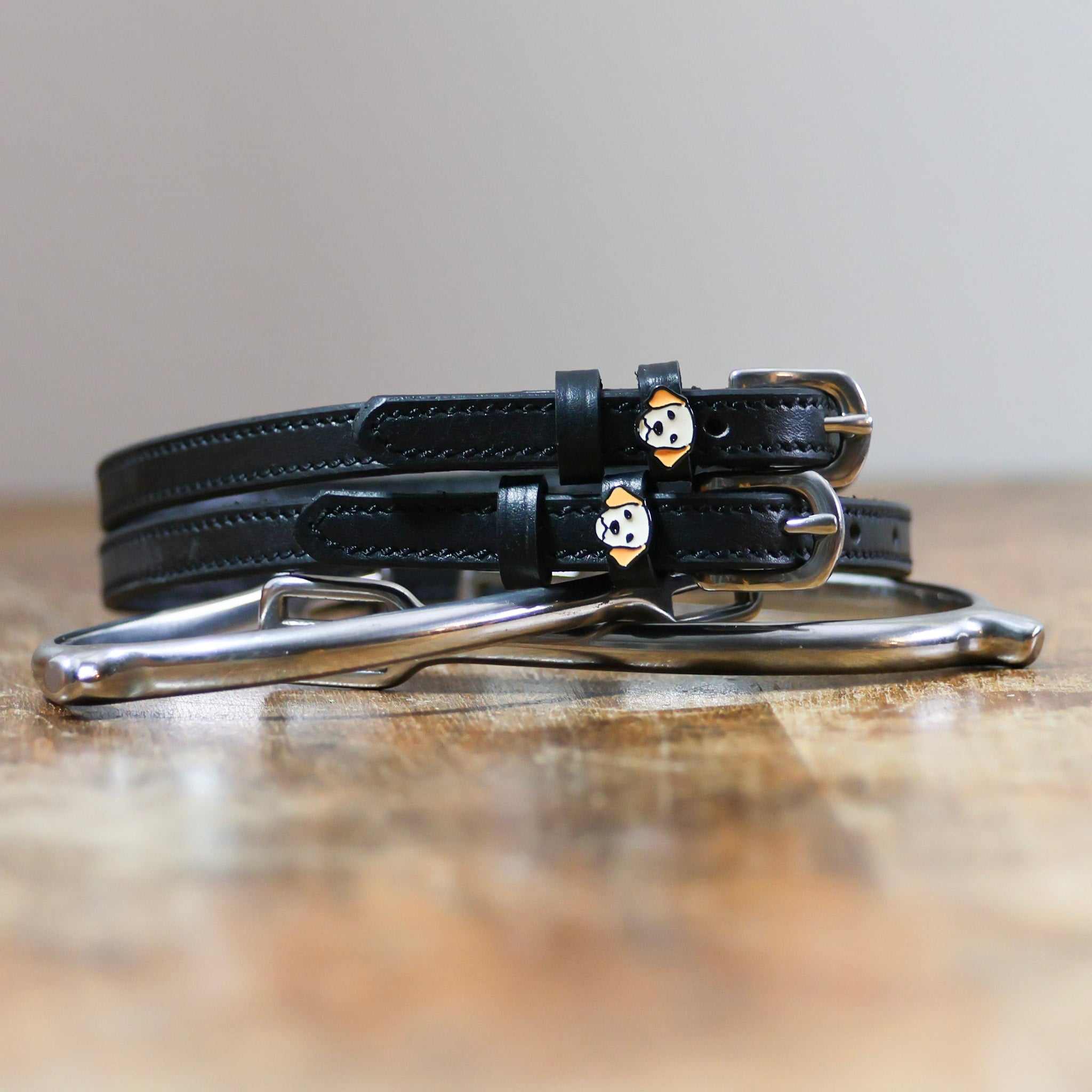ManeJane Dog - Golden Retriever Spur Straps Spur Straps — black leather, non-stretch, hero image for English riders.