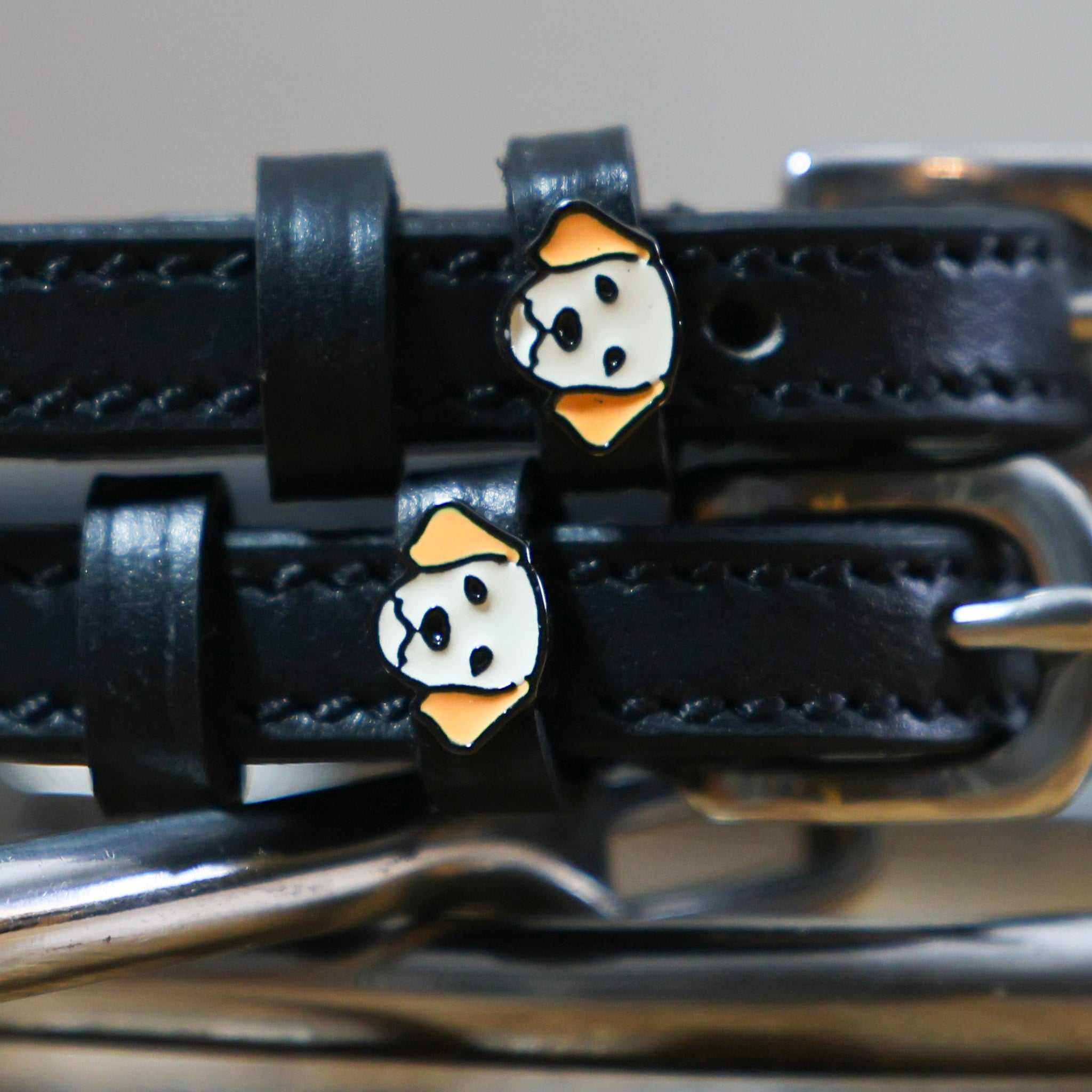 Black leather Golden Retriever spur straps with stainless steel buckles and custom dog charms