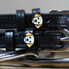 Black leather Golden Retriever spur straps with stainless steel buckles and custom dog charms