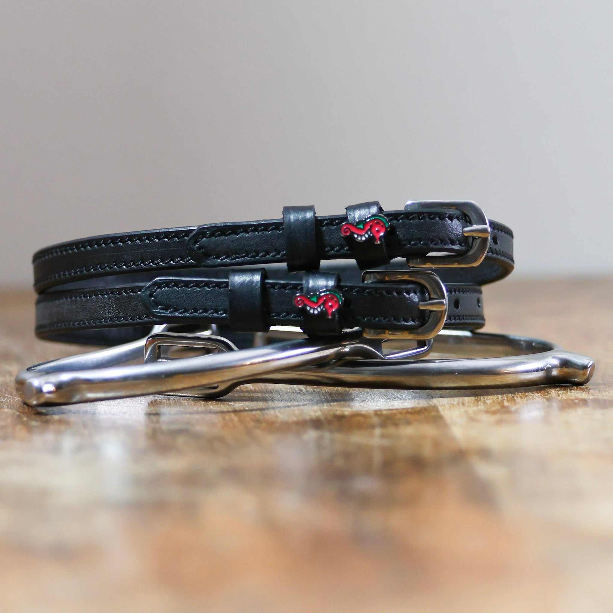 ManeJane Seahorse Spur straps Spur Straps — black leather, non-stretch, hero image for English riders.
