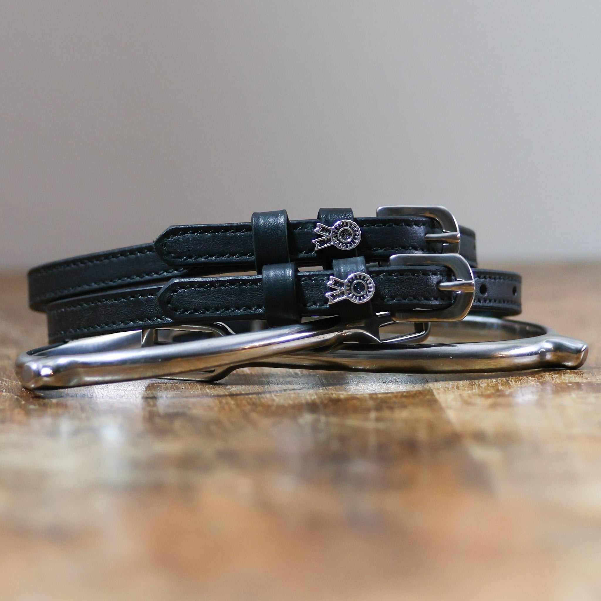 ManeJane Rosette Spur Straps Spur Straps — black leather, non-stretch, hero image for English riders.