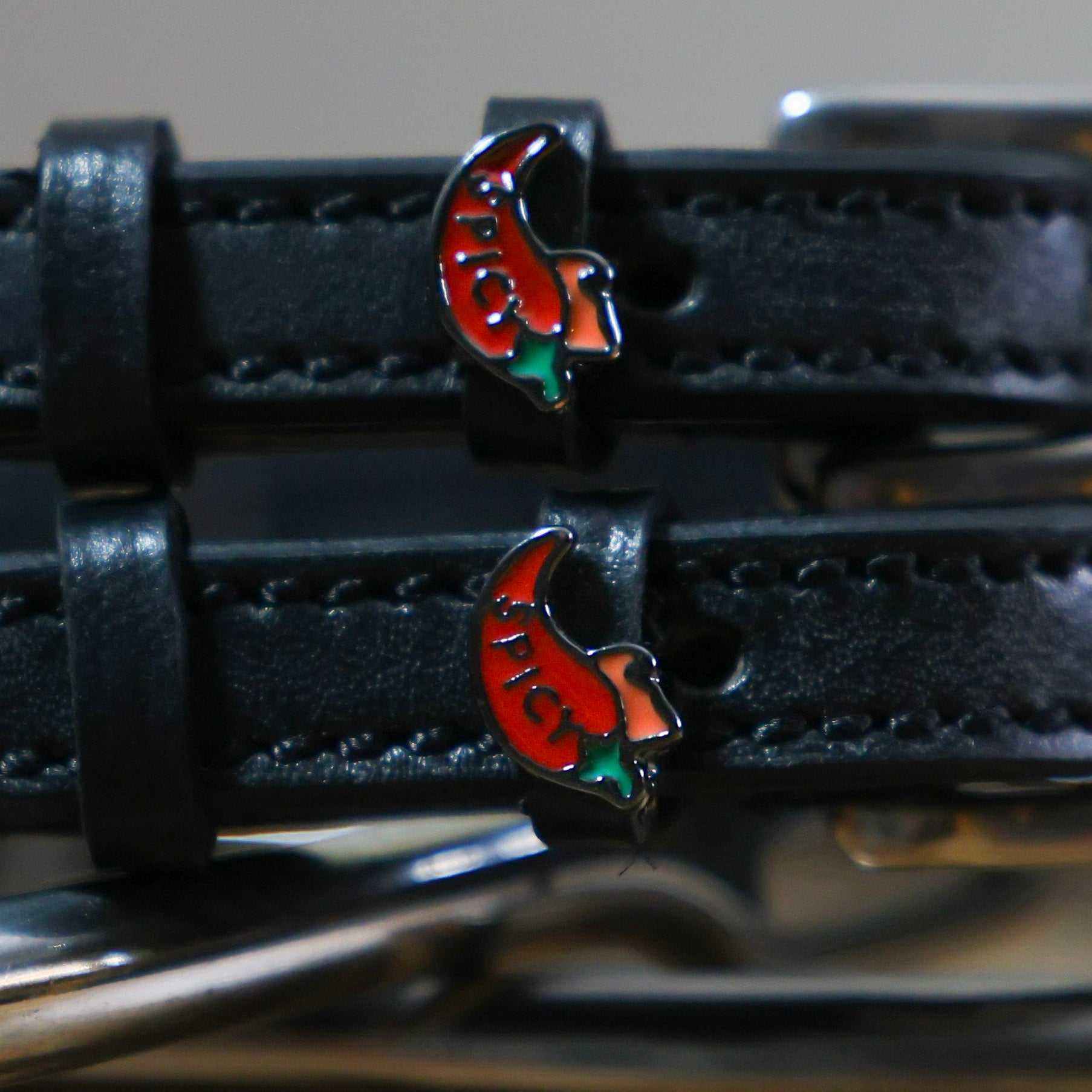 Black leather Spicy Pepper Spur Straps with stainless steel buckle and custom chili pepper charm