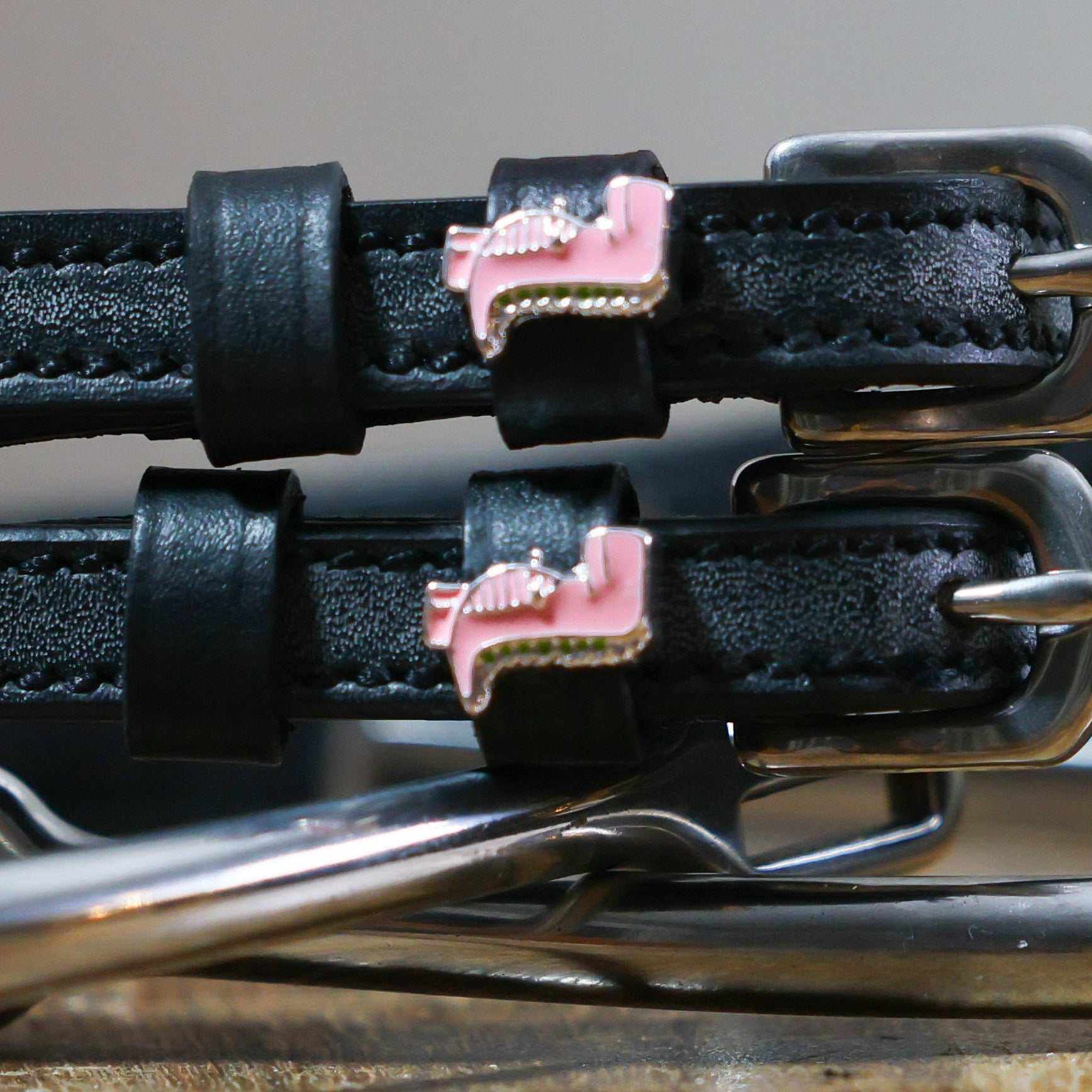Pink Dinosaur Spur Straps black leather with pink dinosaur charm and stainless steel buckle