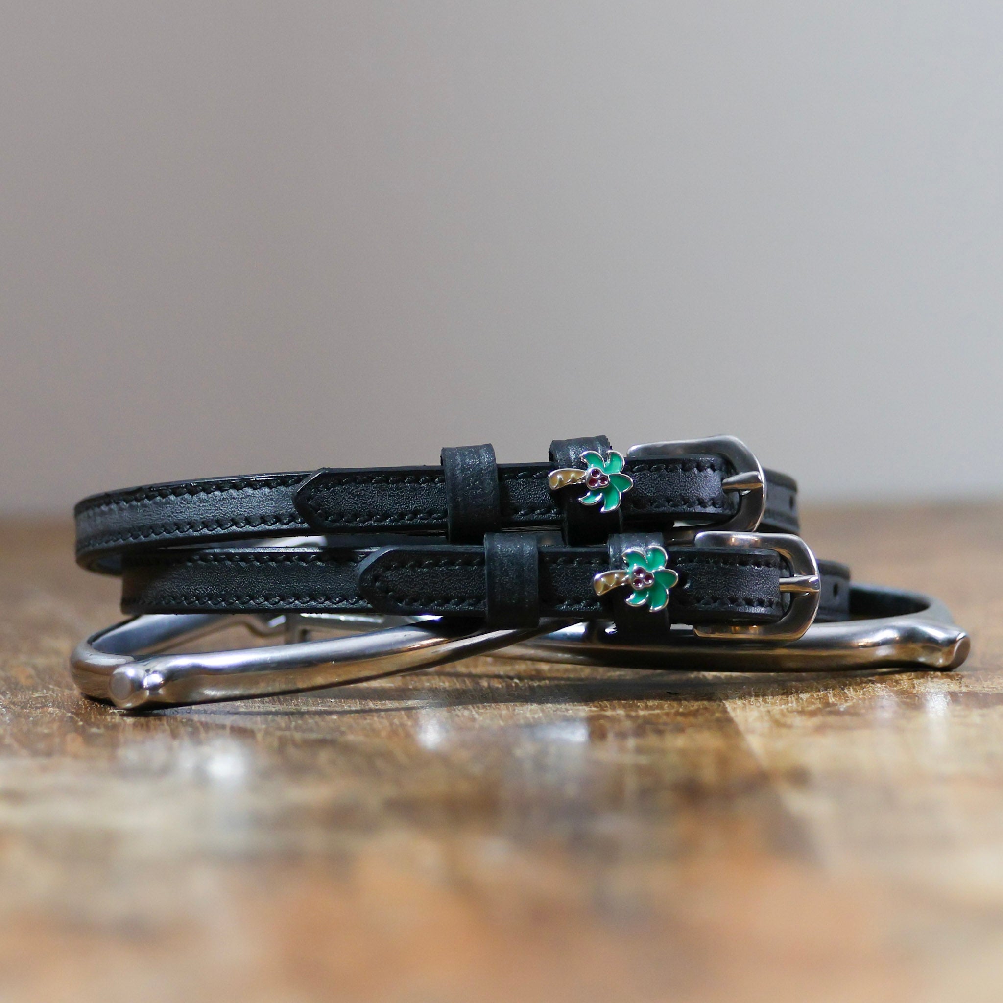 Palm Tree Spur Straps ManeJane black leather spur straps with non-stretch interior and stainless steel buckle for English r.