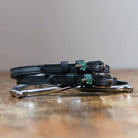 ManeJane Palm Tree Spur Straps Spur Straps — black leather, non-stretch, hero image for English riders.