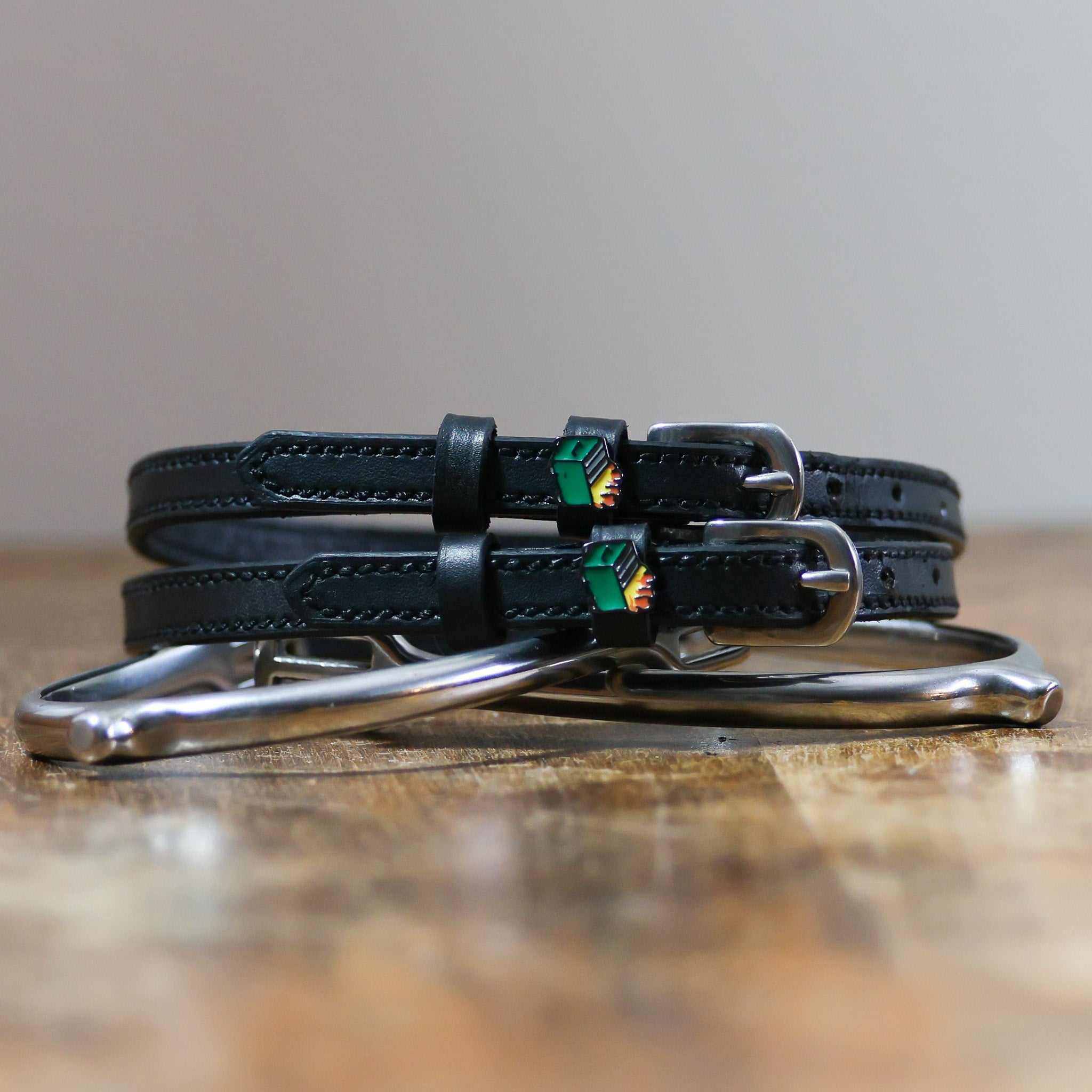 ManeJane Dumpster Fire Spur Straps Spur Straps — black leather, non-stretch, hero image for English riders.
