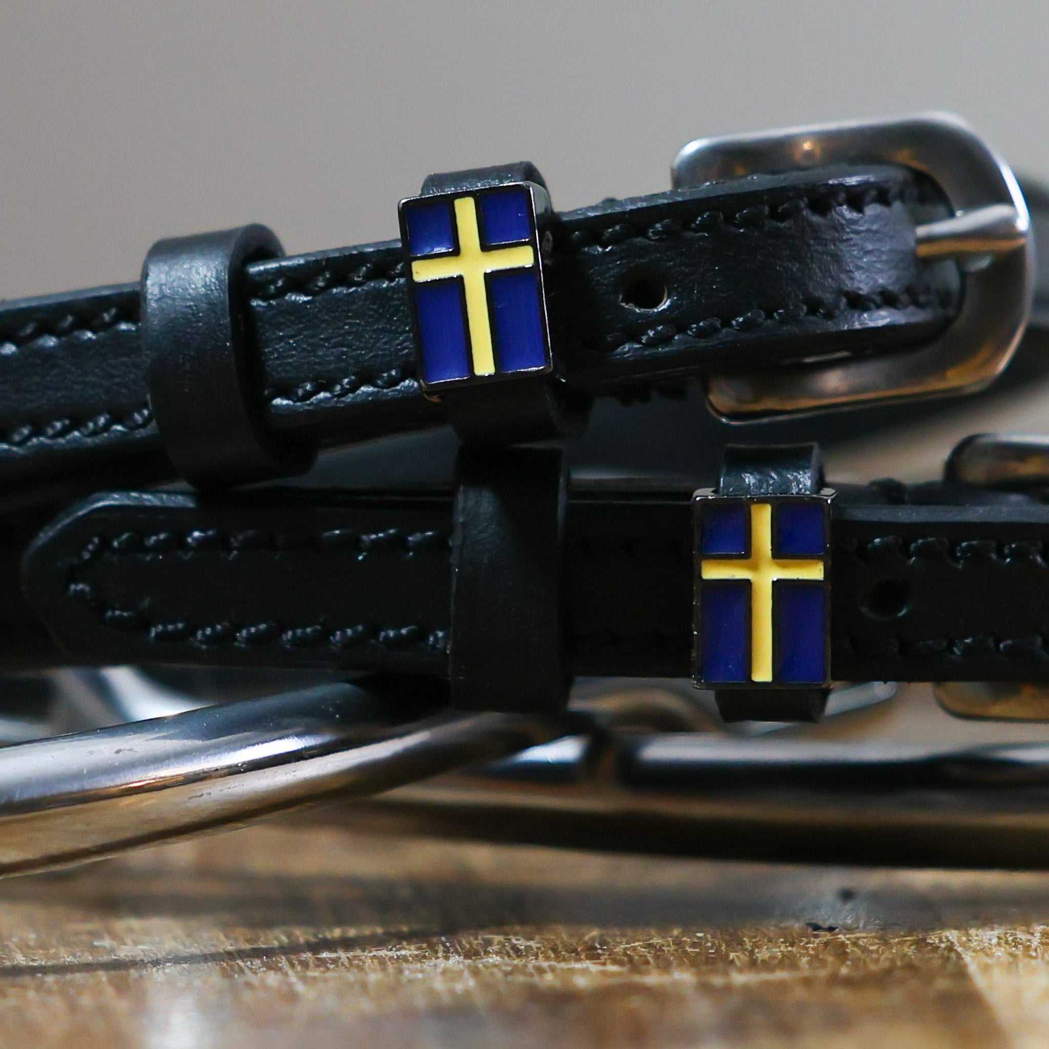 Black leather Swedish Flag Spur Straps with stainless steel buckle and custom charm