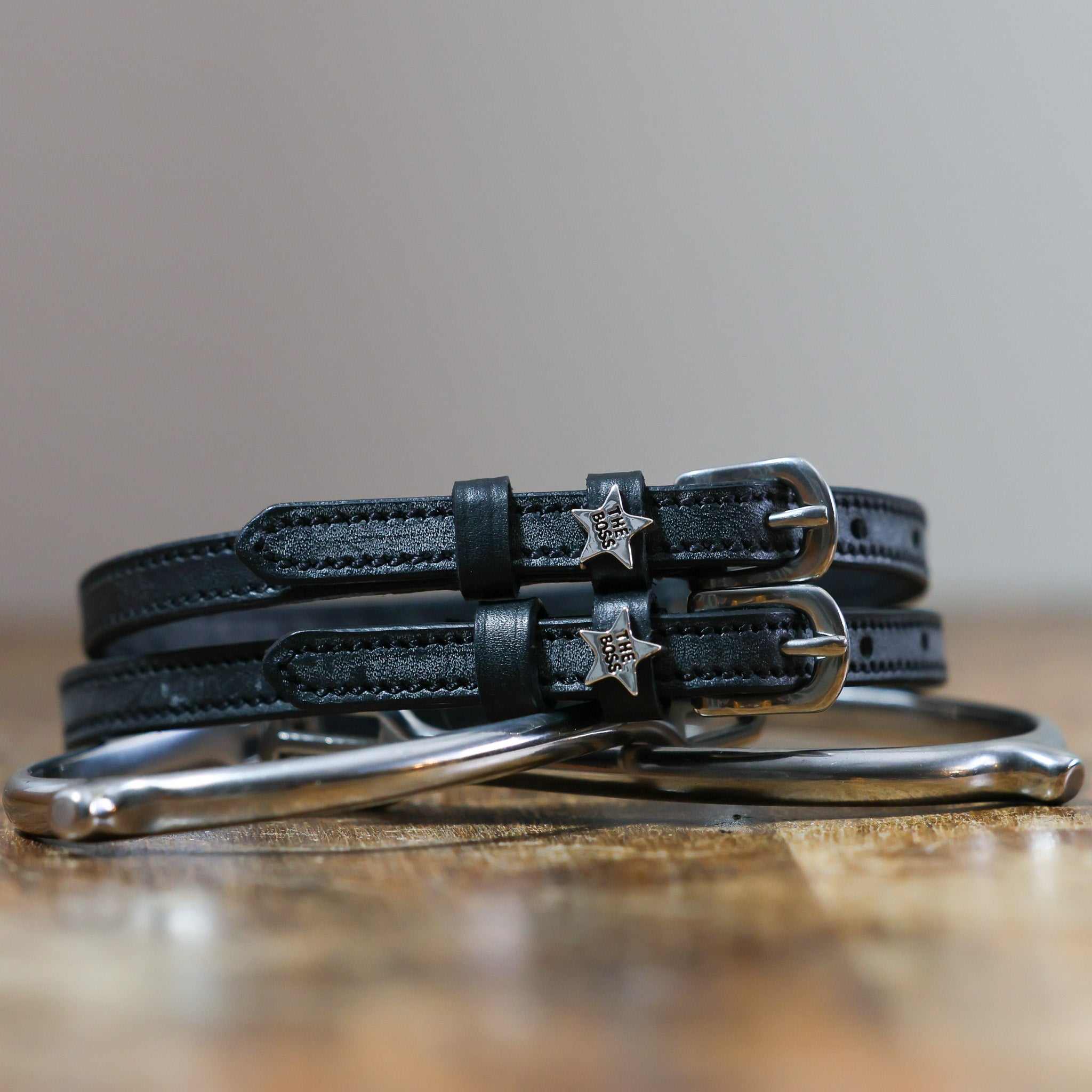 ManeJane The Boss Star Silver Spur Straps Spur Straps — black leather, non-stretch, hero image for English riders.