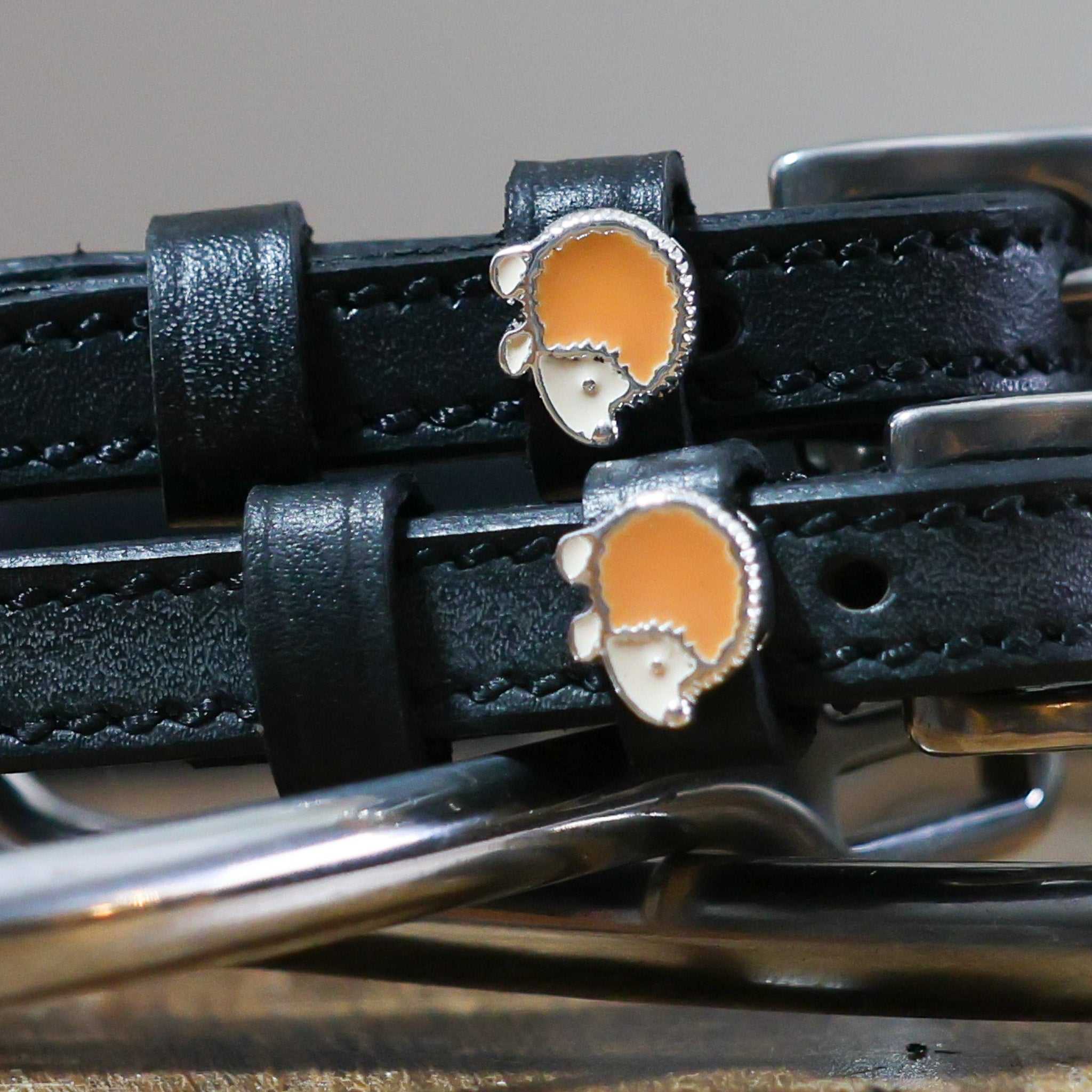 Black leather hedgehog spur straps with stainless steel buckles and custom charm
