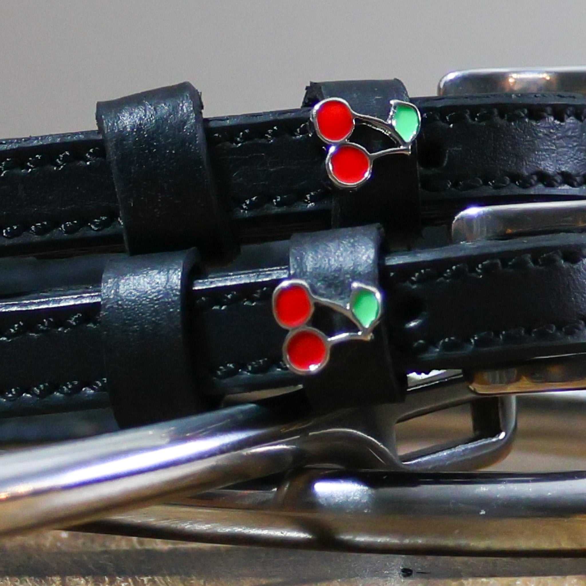Black leather Cherry Spur Straps with stainless steel buckles and cherry charm detail