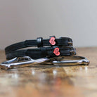 Black leather Pony Love Spur Straps with stainless steel buckles and heart-shaped charms