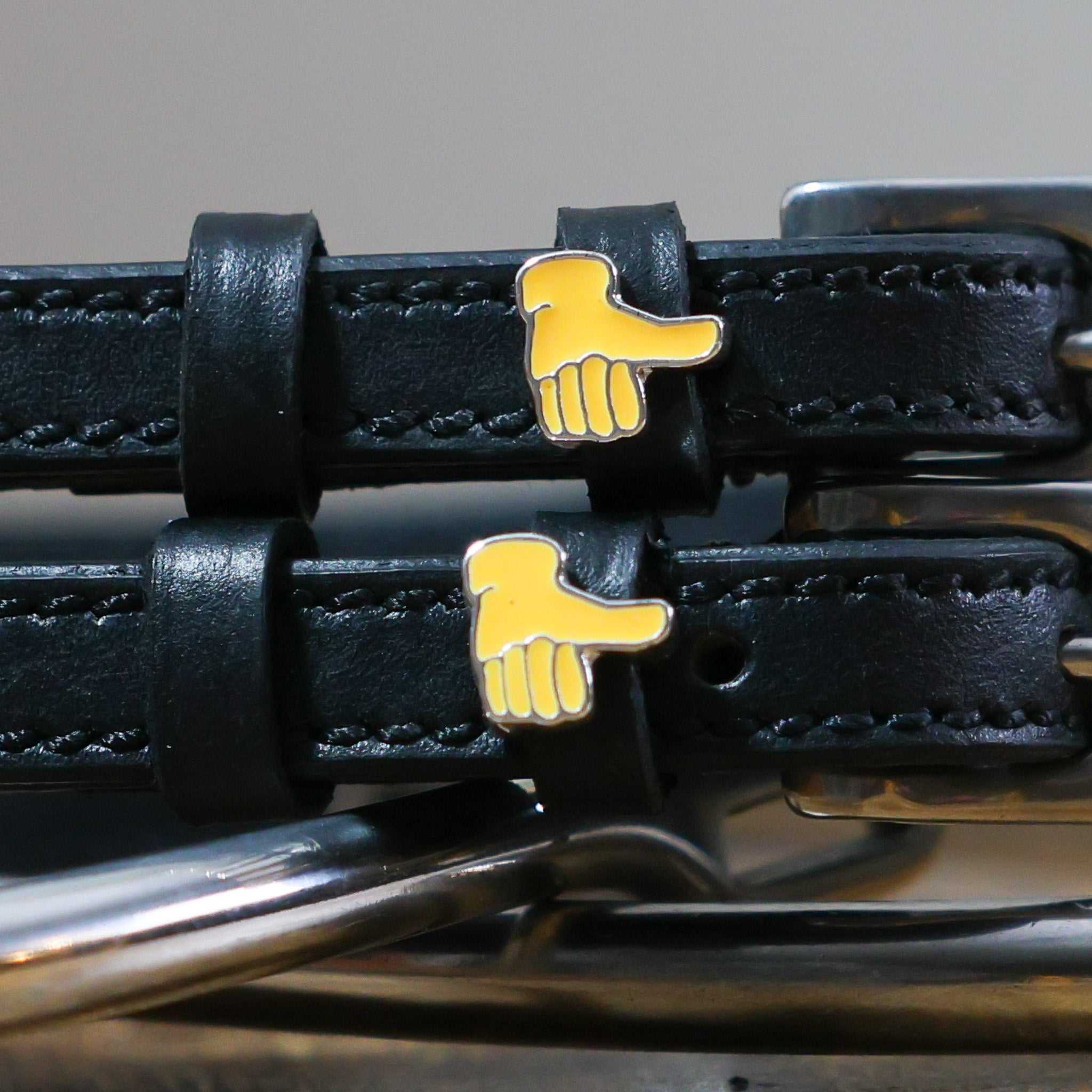 Black leather Thumbs Up Emoji spur straps with stainless steel buckles and custom charm