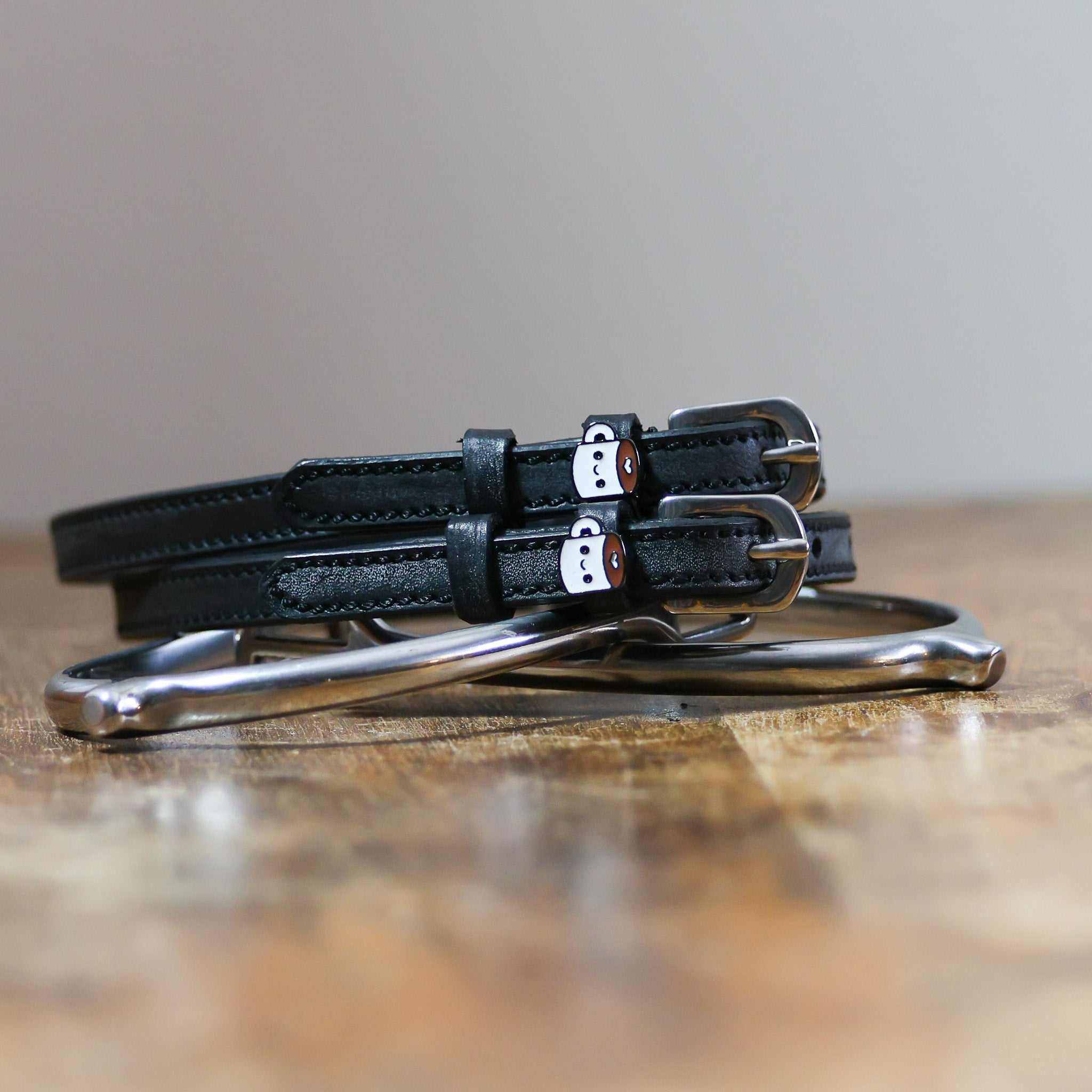 ManeJane Coffee Spur Straps Spur Straps — black leather, non-stretch, hero image for English riders.