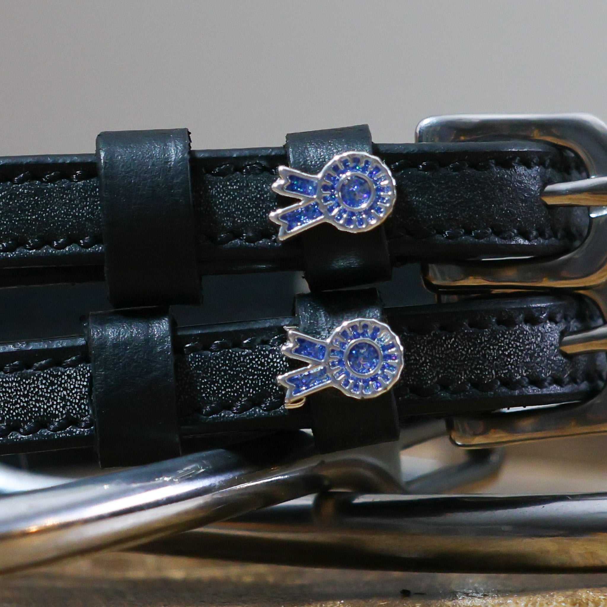 Blue Ribbon Spur Straps black leather with stainless steel buckles and blue ribbon charms