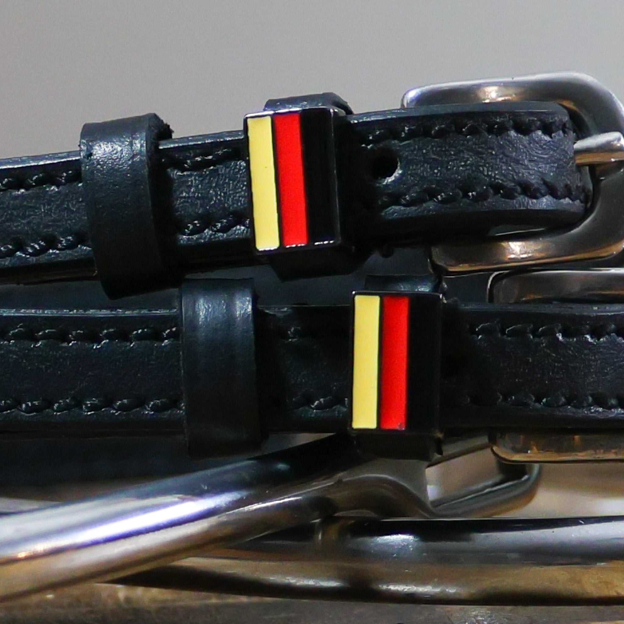 Black leather German flag spur straps with stainless steel buckle and custom charm
