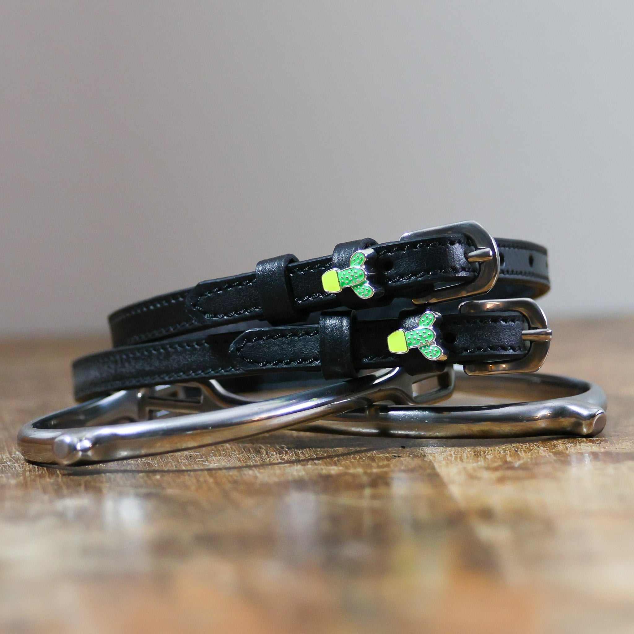 ManeJane Cactus Spur Straps Spur Straps — black leather, non-stretch, hero image for English riders.