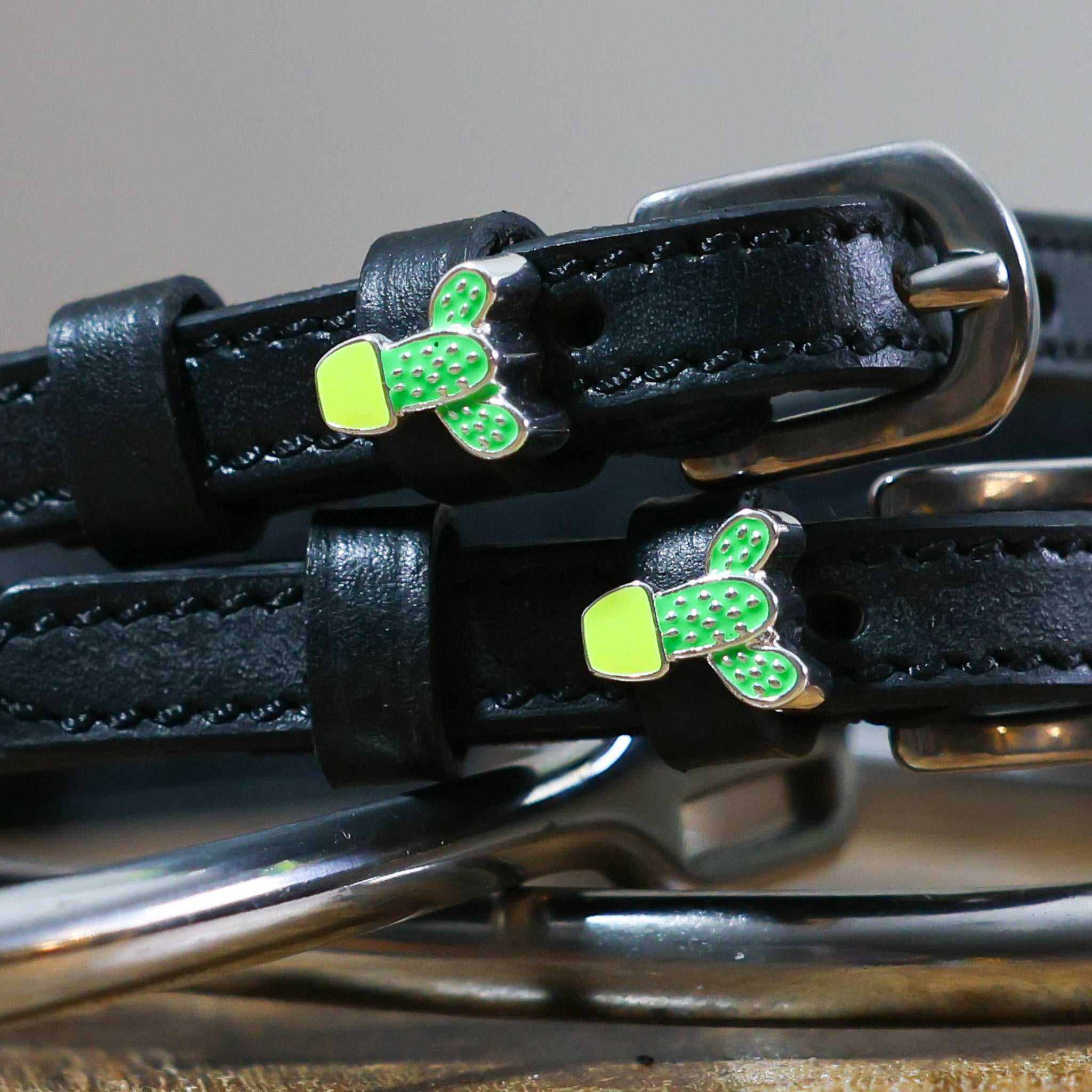 Black leather spur straps with stainless steel buckles and green cactus charms