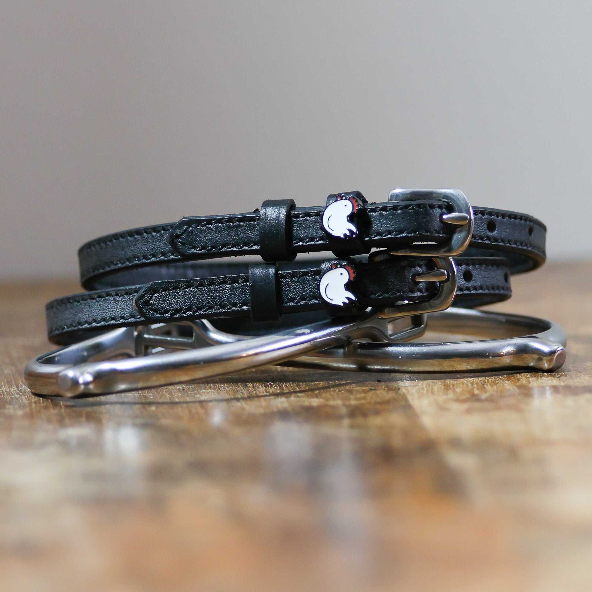 ManeJane Chicken Spur Straps Spur Straps — black leather, non-stretch, hero image for English riders.