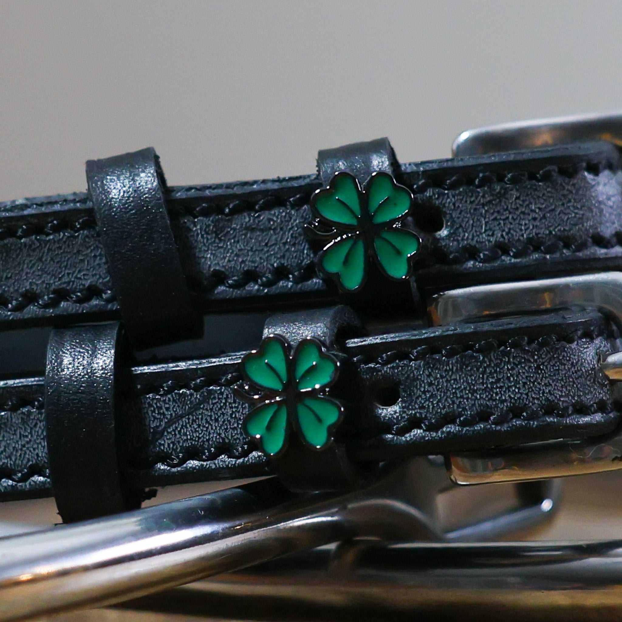 Black leather Four Leaf Clover Spur Strap with green clover charm and stainless steel buckle