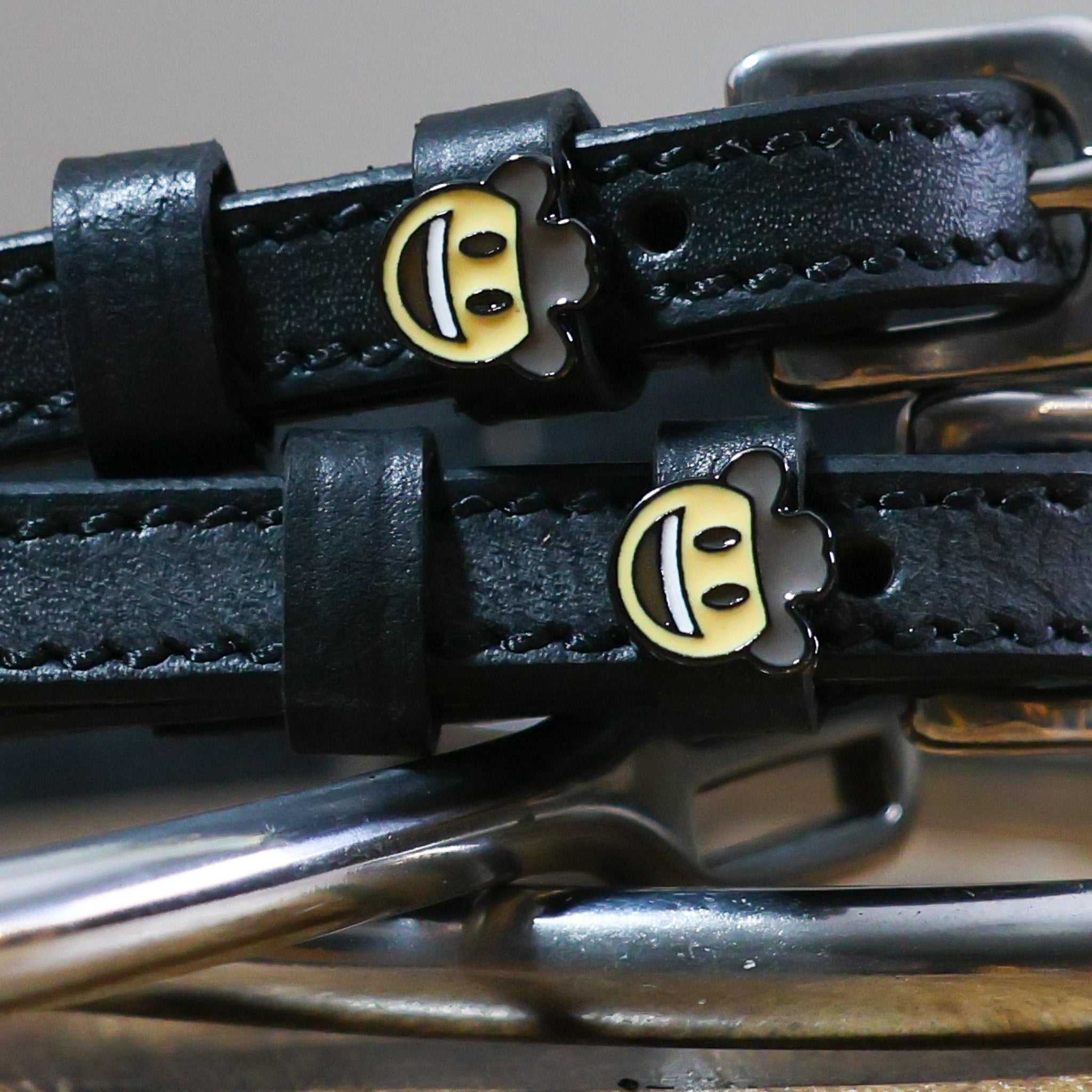 Black leather Cowboy Emoji Spur Strap with stainless steel buckle and custom cowboy hat emoji charm