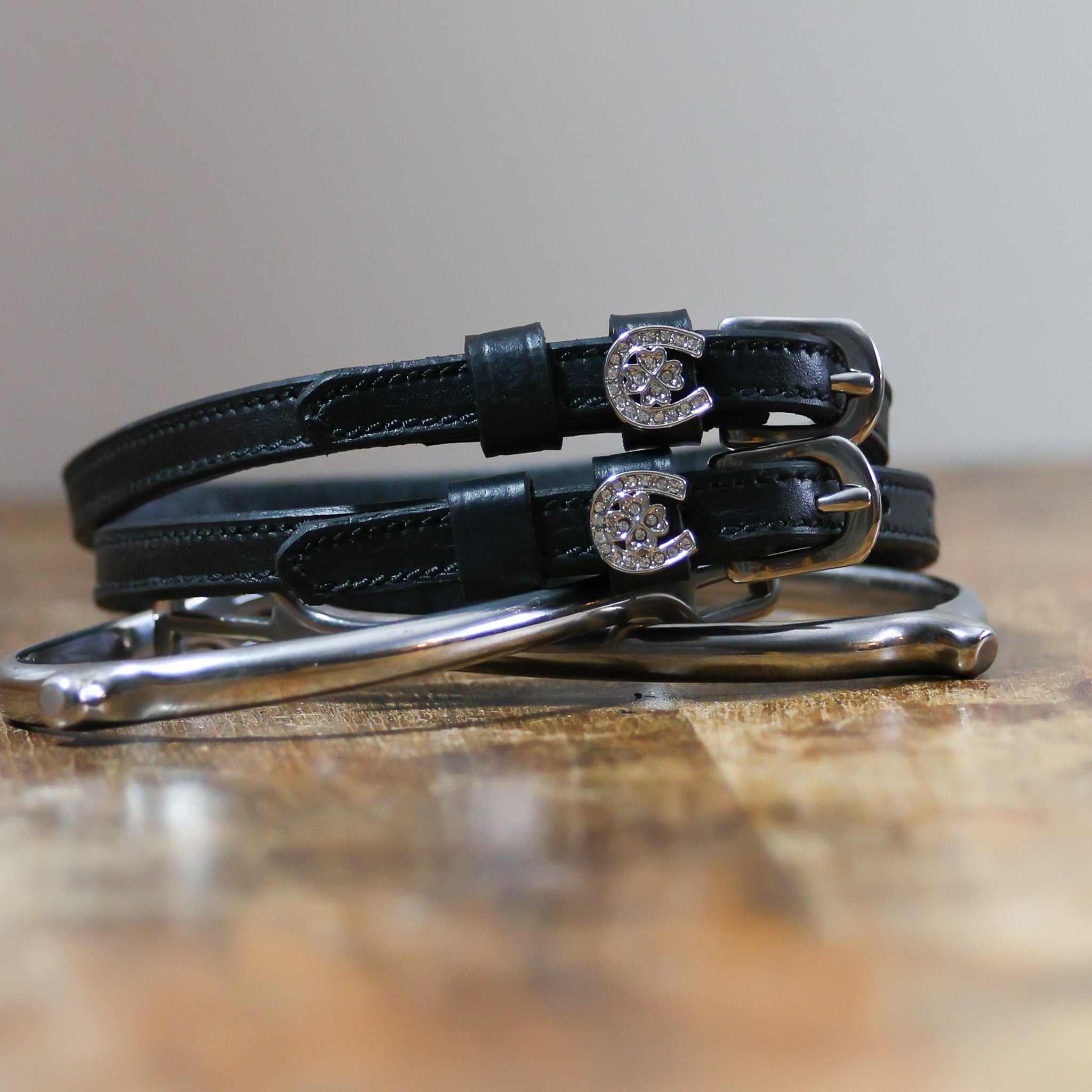 ManeJane Horse Shoe Clover Spur Straps Spur Straps — black leather, non-stretch, hero image for English riders.