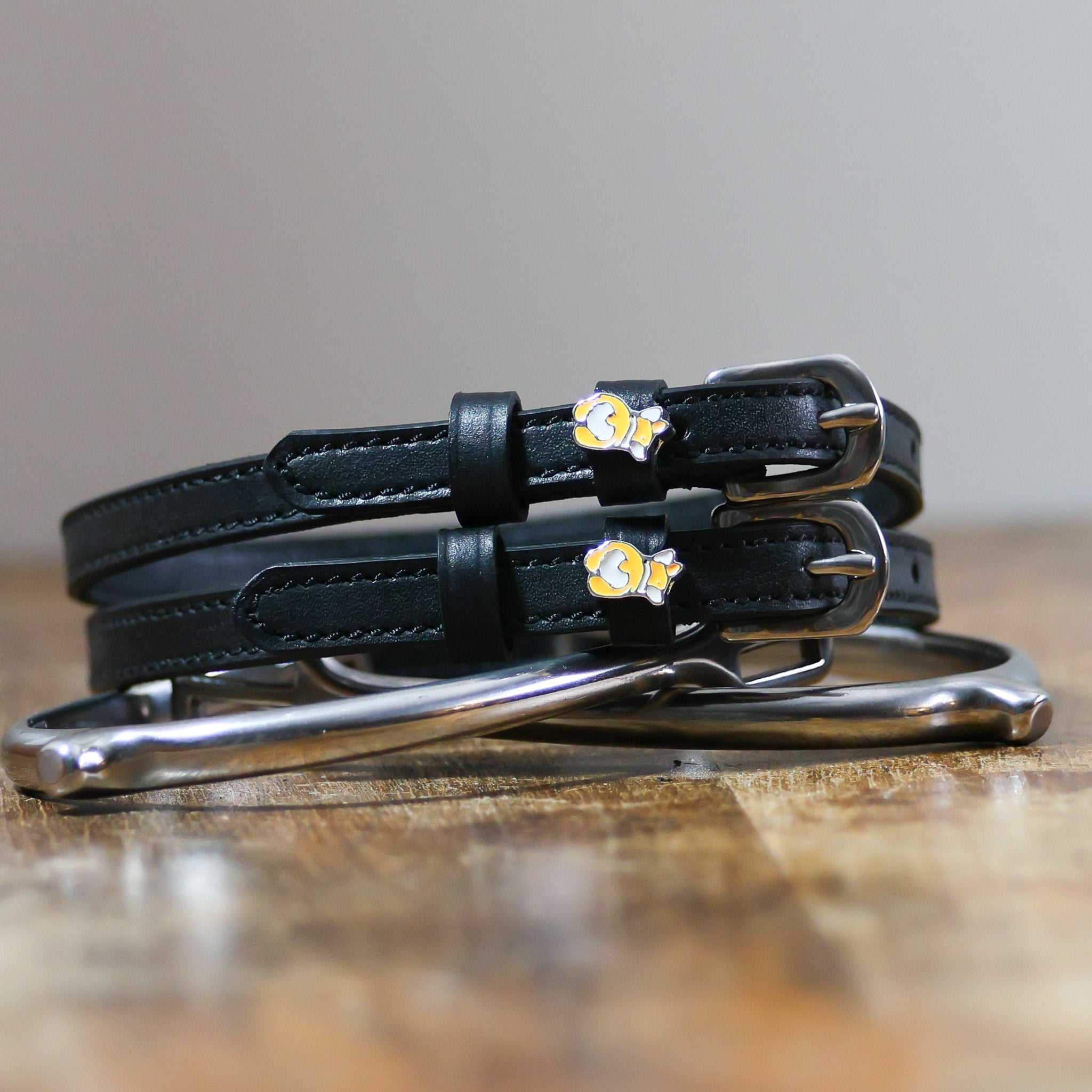 ManeJane Corgi Butts Spur Straps Spur Straps — black leather, non-stretch, hero image for English riders.