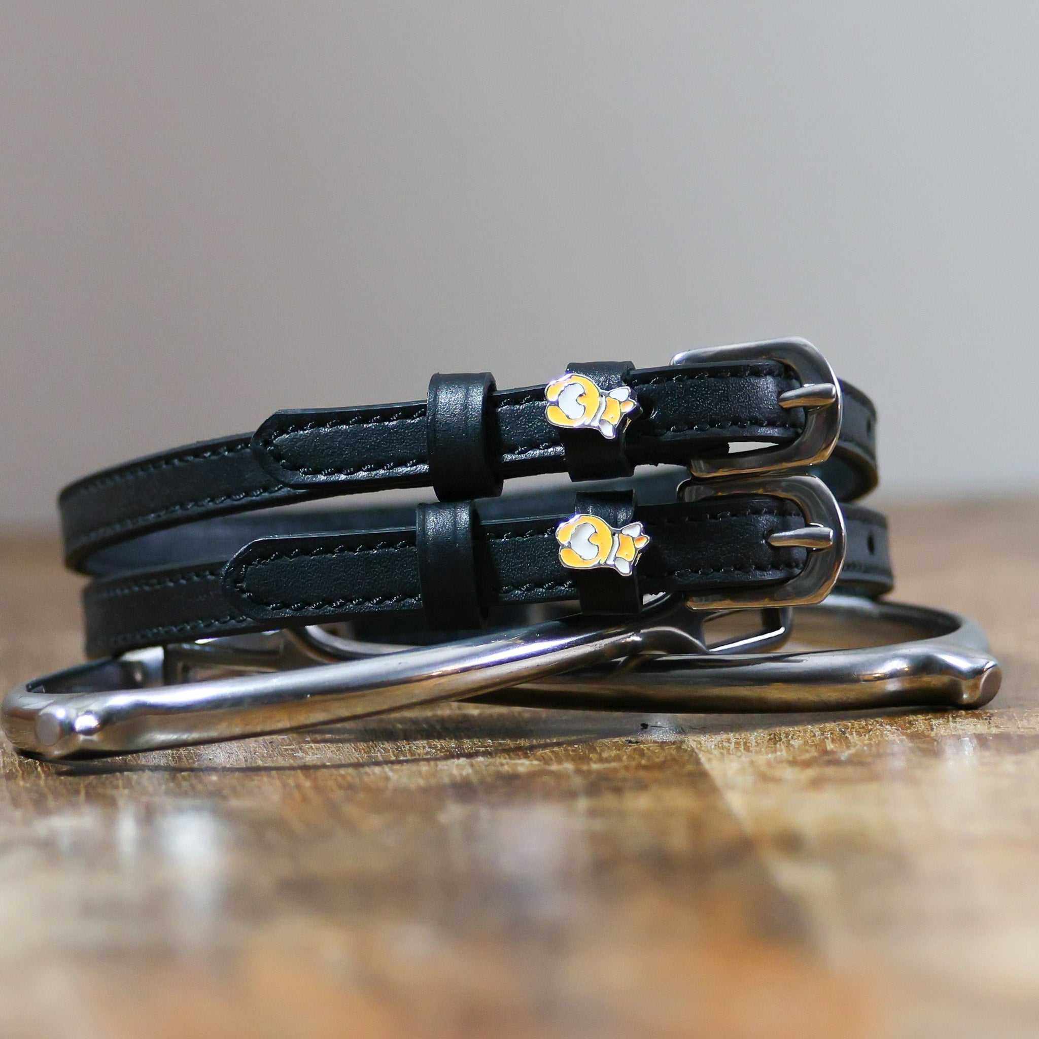 ManeJane Corgi Butts Spur Straps Spur Straps — black leather, non-stretch, hero image for English riders.