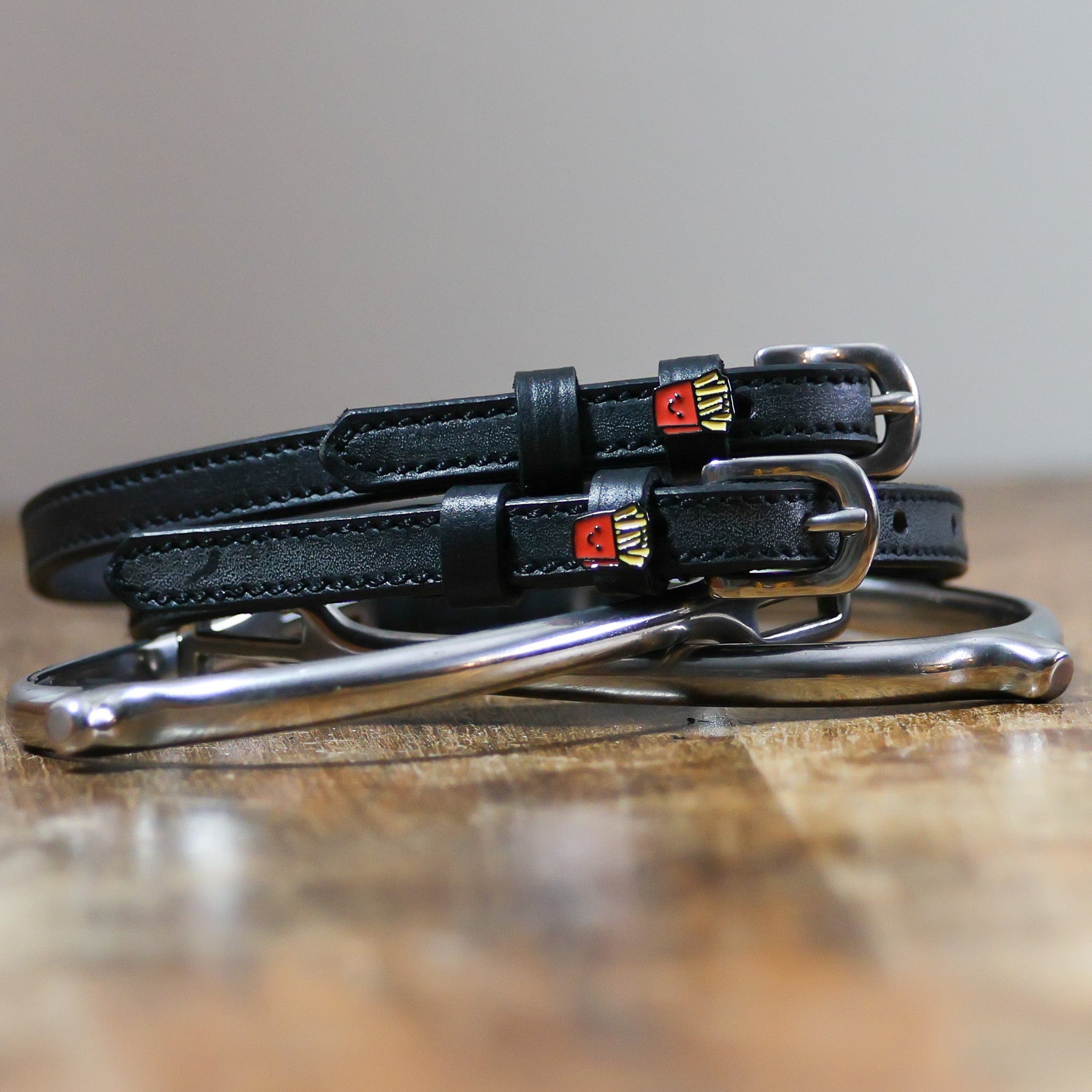 ManeJane French Fries Spur Straps Spur Straps — black leather, non-stretch, hero image for English riders.