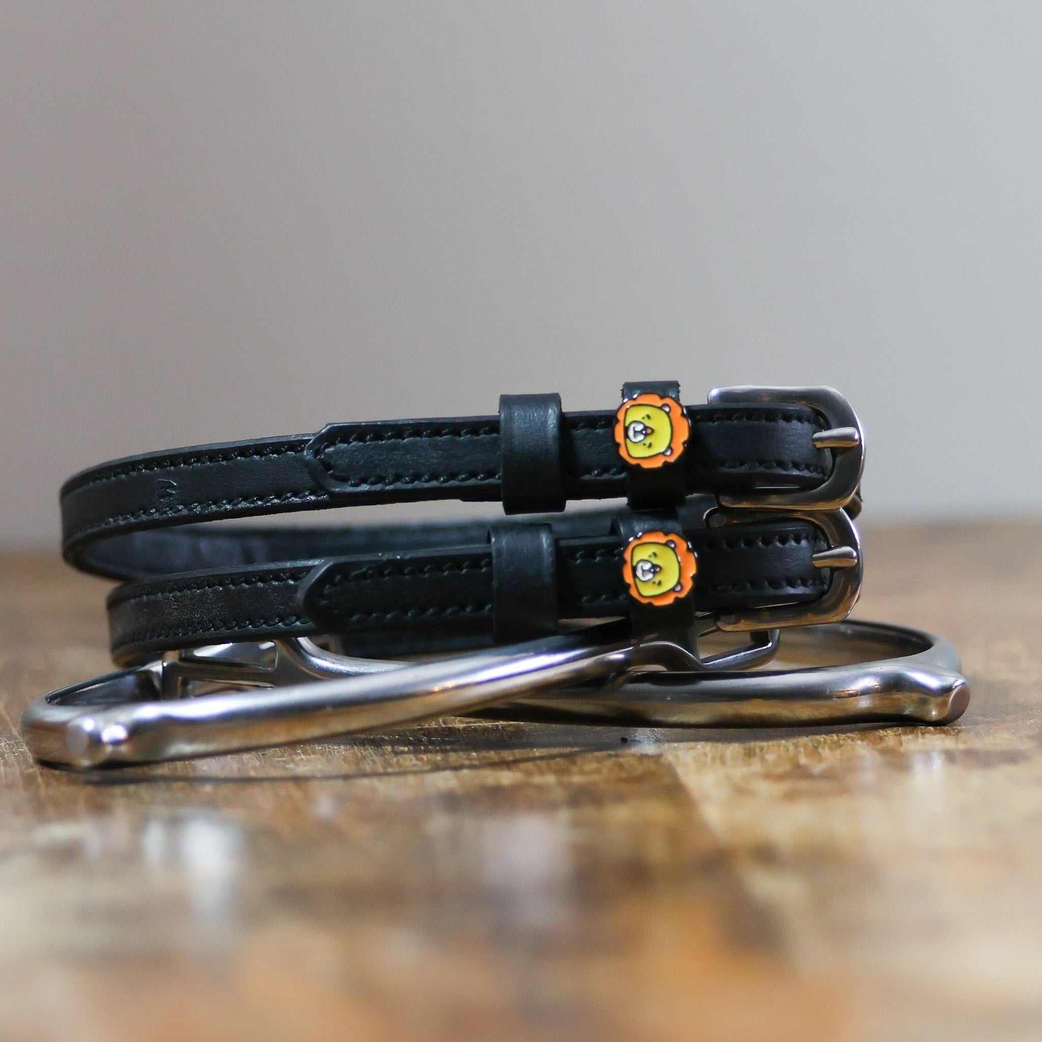 ManeJane Lion Spur Straps Spur Straps — black leather, non-stretch, hero image for English riders.