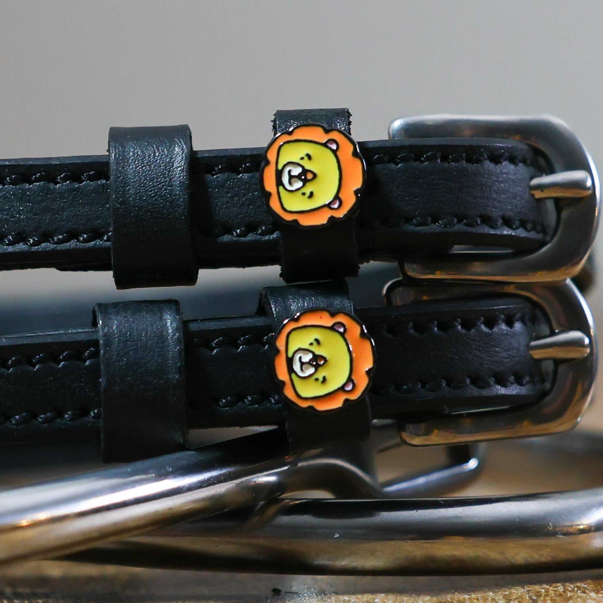 Black leather Lion Spur Straps with stainless steel buckles and custom lion face charms