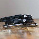 ManeJane Fingers Crossed Spur Straps Spur Straps — black leather, non-stretch, hero image for English riders.