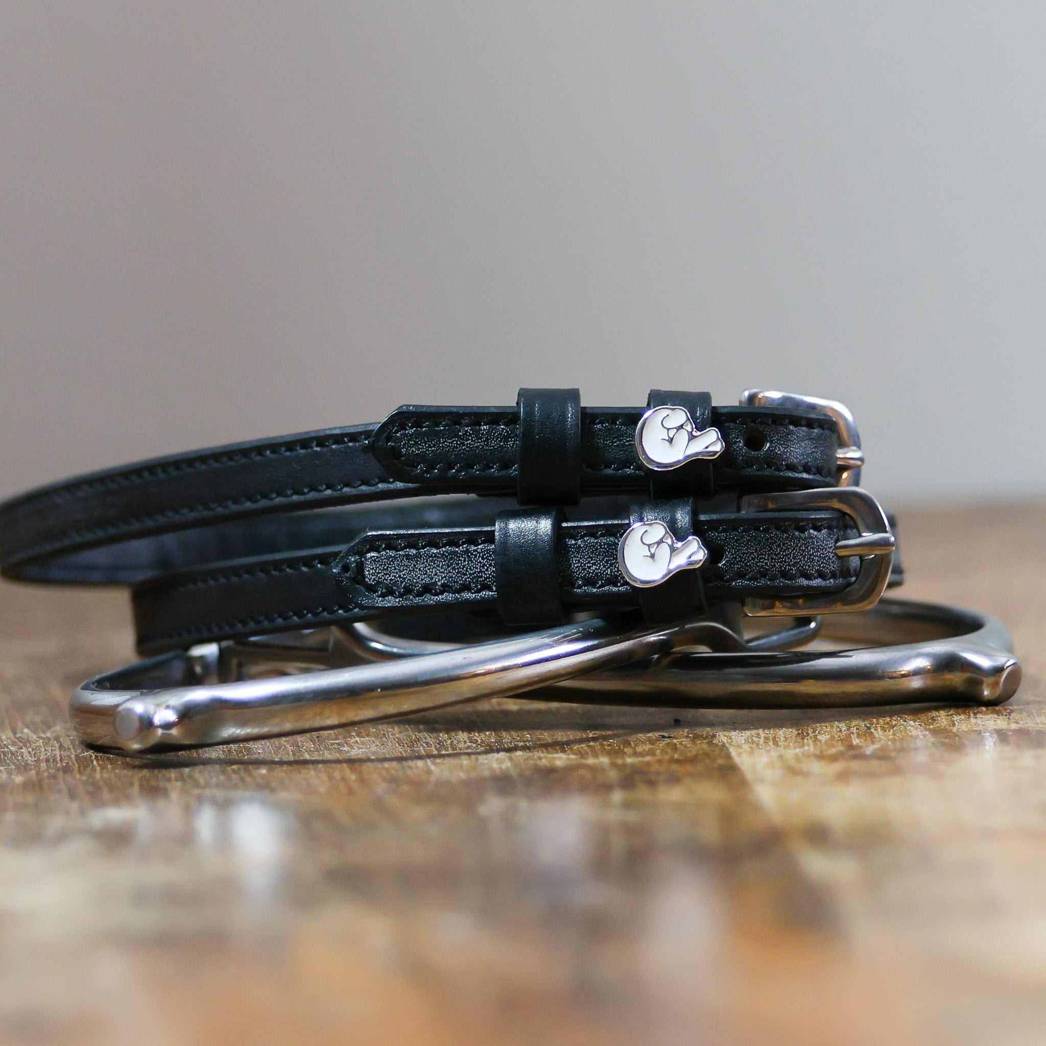 ManeJane Fingers Crossed Spur Straps Spur Straps — black leather, non-stretch, hero image for English riders.
