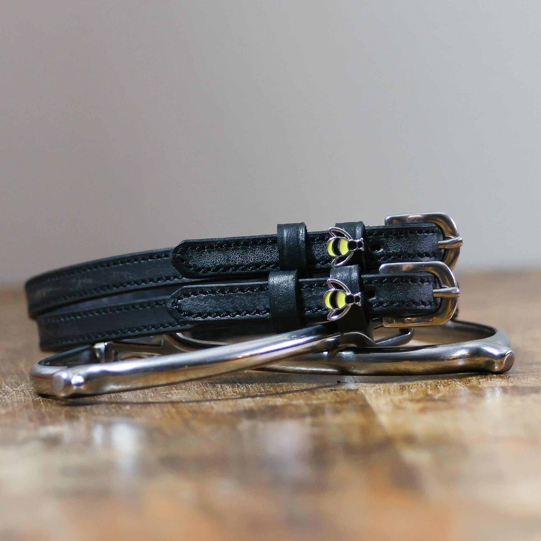ManeJane Bee Spur Straps Spur Straps — black leather, non-stretch, hero image for English riders.